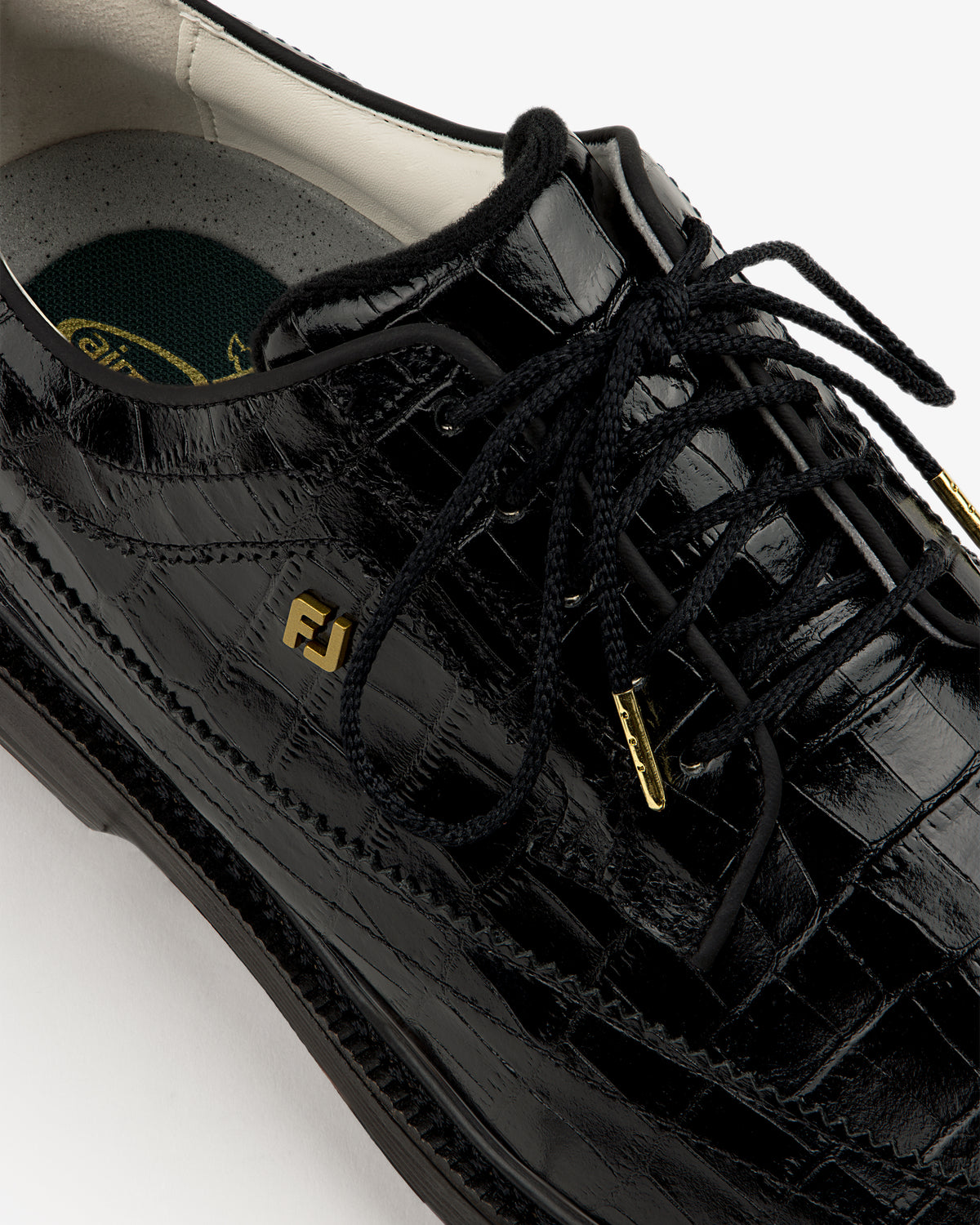 Close-up of the ALD / Footjoy Croc-Embossed Premiere Series Marquis dress shoe with gold FJ logo on the side.