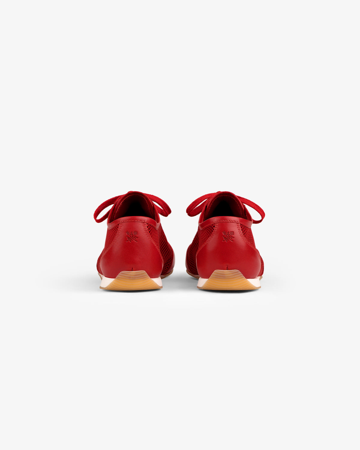 Low Profile Mesh Trainer in red, viewed from the back showing heels and light brown outsoles on a white background.
