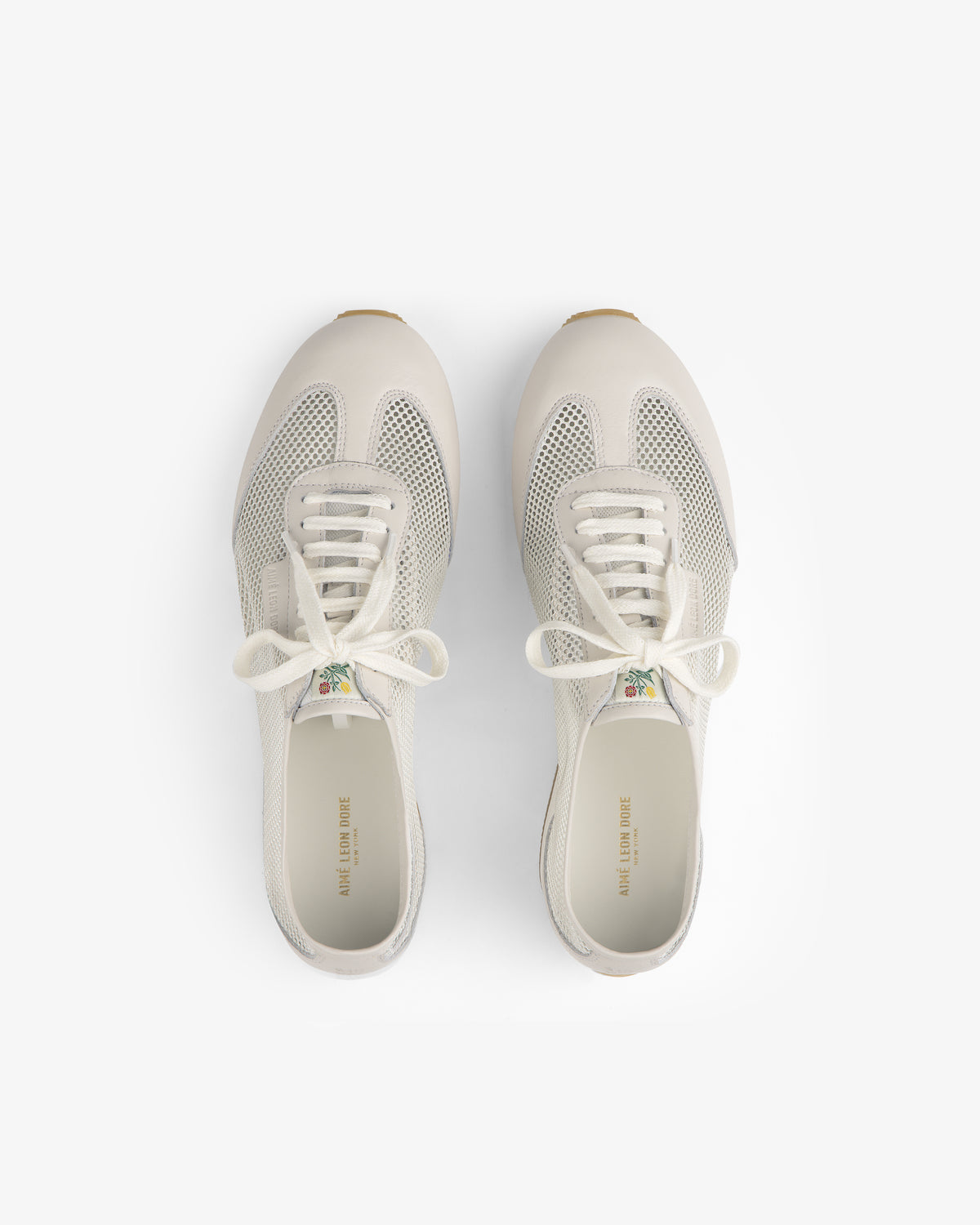 The Low Profile Mesh Trainer sneakers with white laces, seen from above on a plain white background.