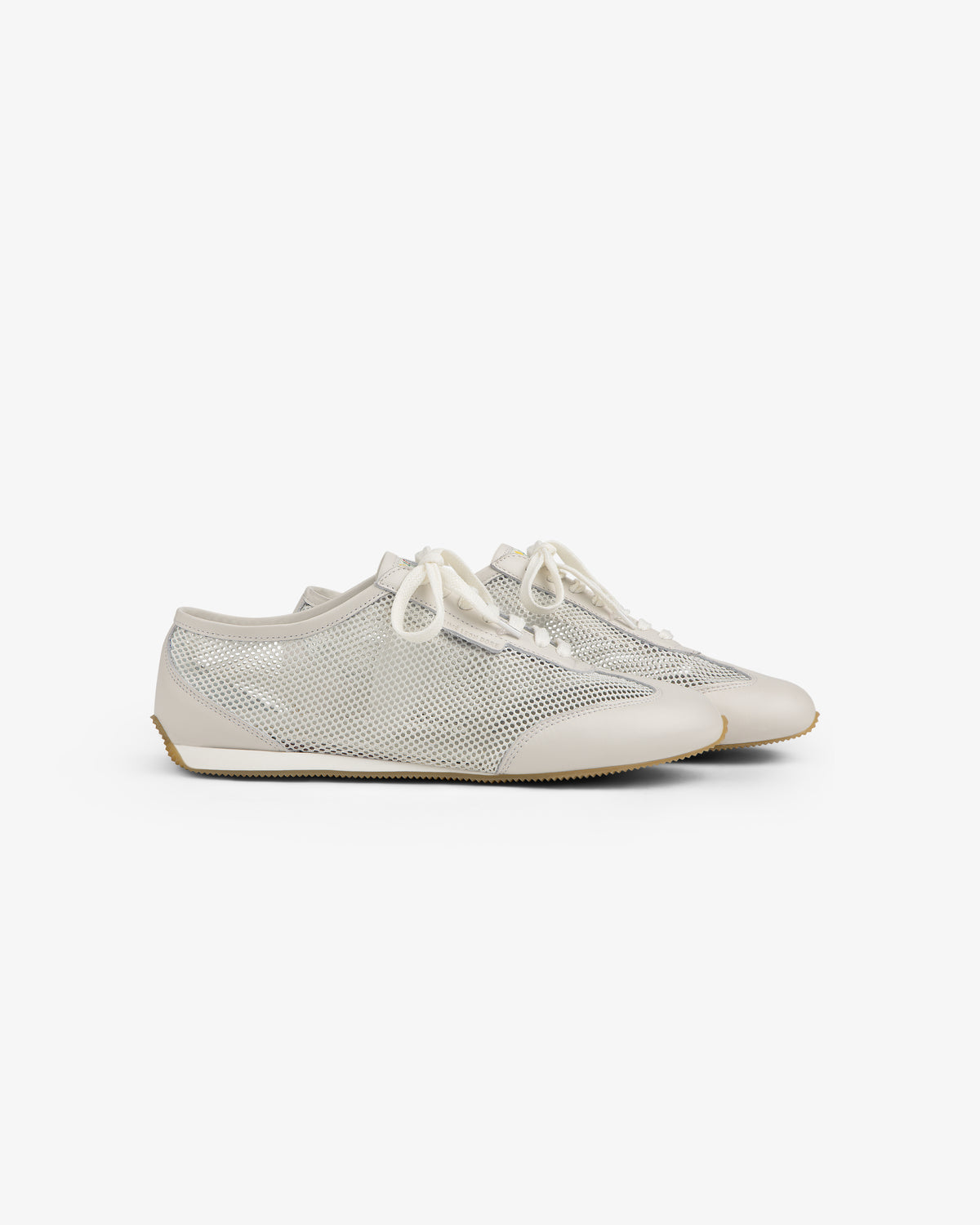 A pair of beige and white Low Profile Mesh Trainer sneakers with white laces on a white background.