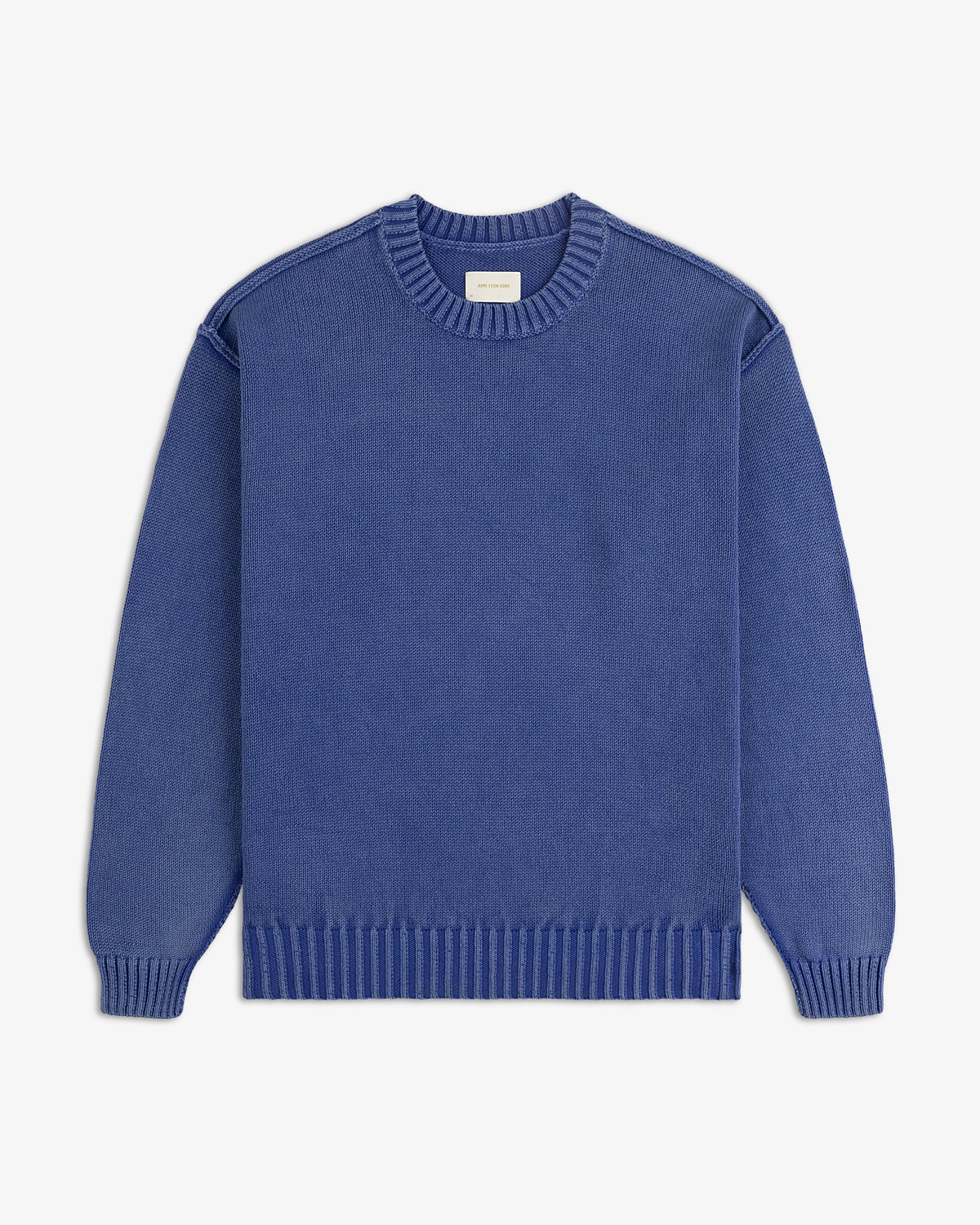 The Washed Inside Out Sweater is a plain blue knit with long sleeves, ribbed cuffs, neckline, and hem on white background.