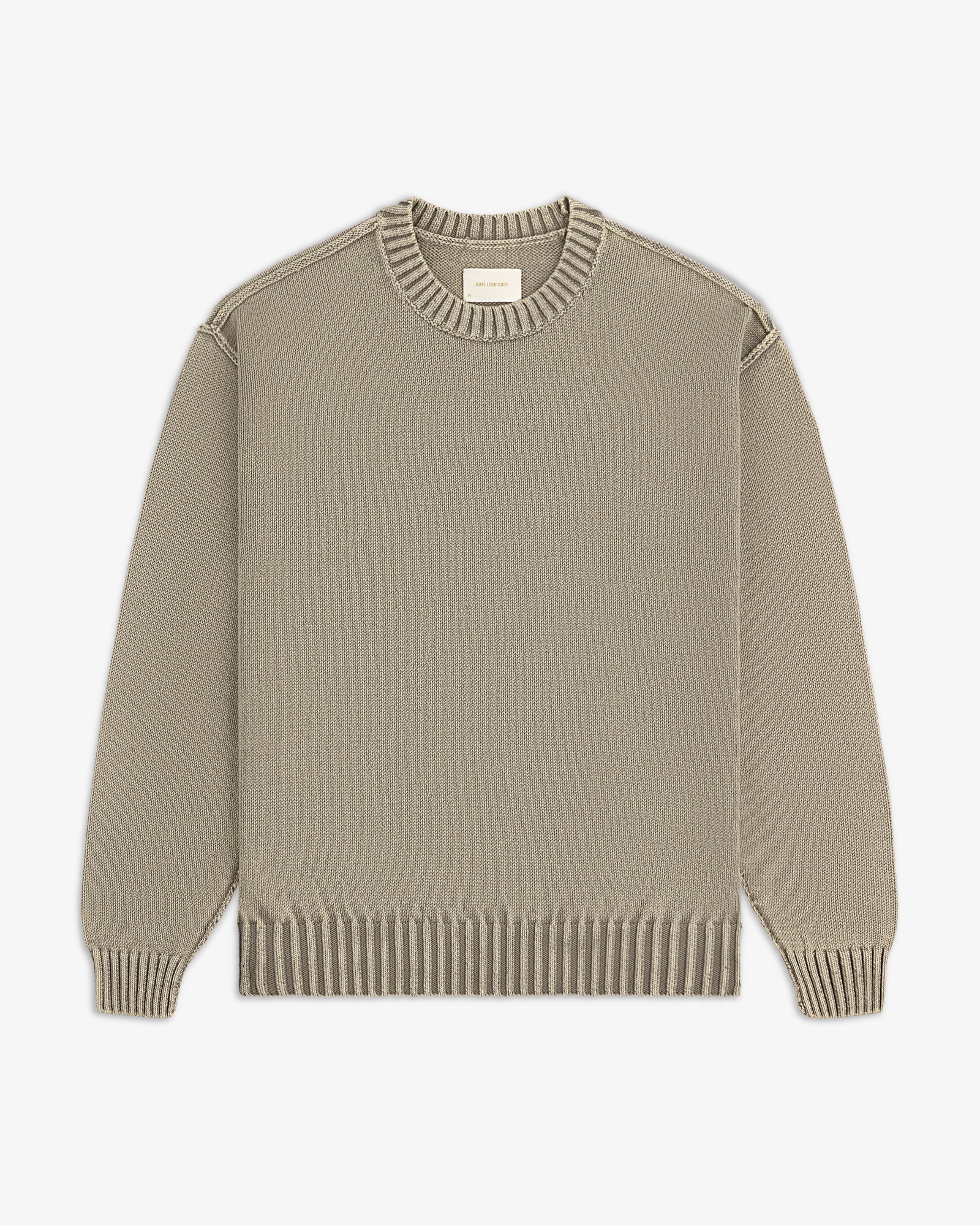 Washed Inside Out Sweater in beige with ribbed collar, cuffs, and hem, laid flat on a white background.