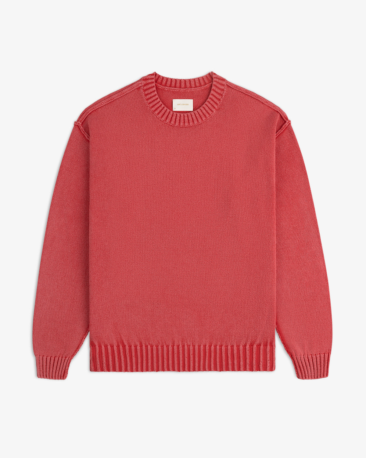 A Washed Inside Out Sweater with long sleeves and crew neck in red, laid flat on a white background.