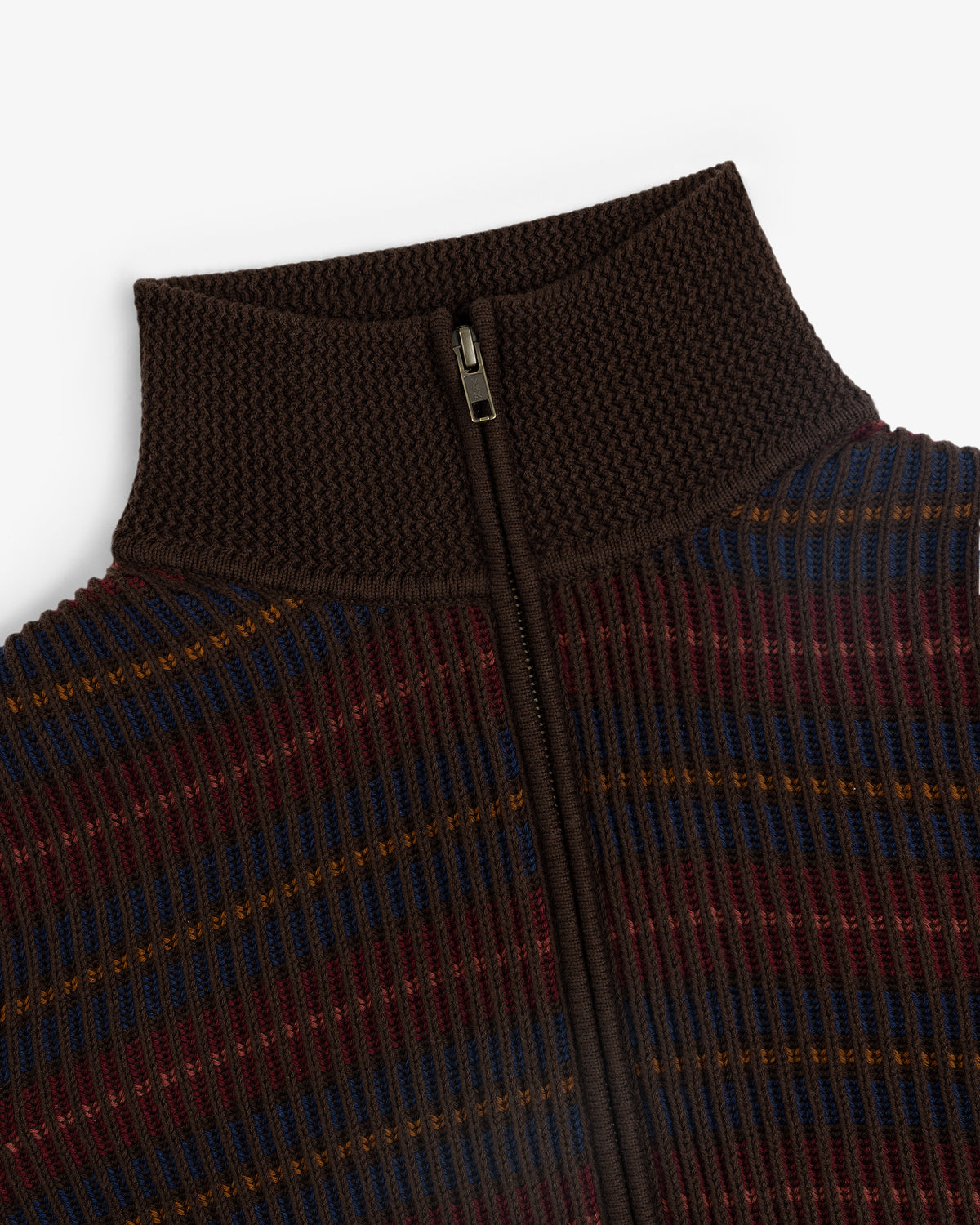 Close-up of the Multi Color Knit Track Sweater featuring ribbed knit, a textured brown high collar, and a front zipper.