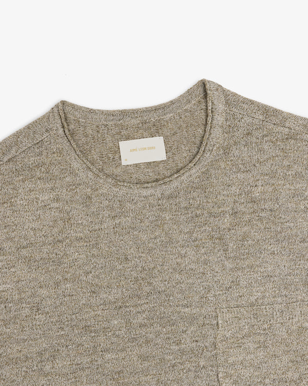 A close-up of a light gray Long-Sleeve Knit Pocket Tee with a visible beige label inside the collar.