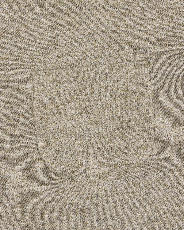 Close-up of a small sewn pocket on the Long-Sleeve Knit Pocket Tee, highlighting beige knit texture and stitching.