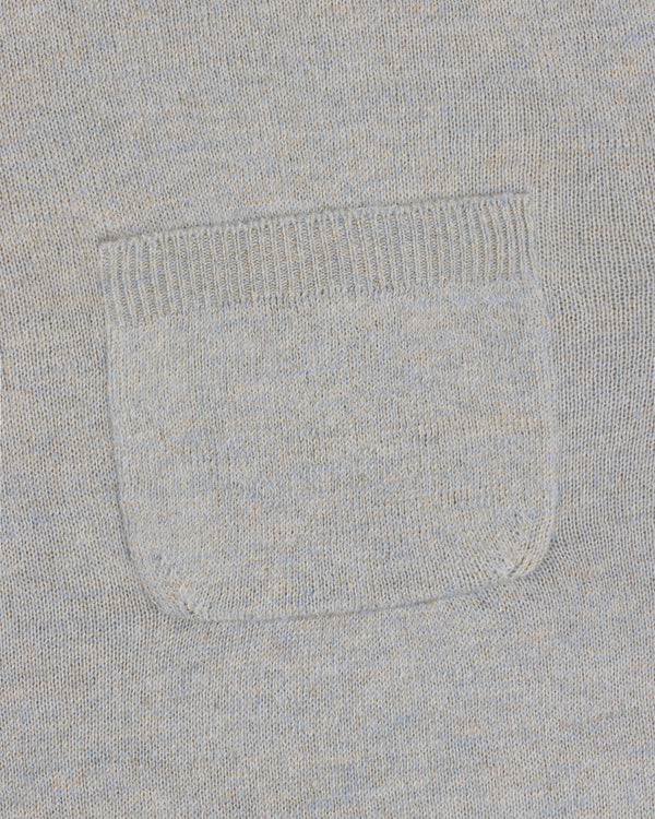 Close-up of the square patch pocket on the Long-Sleeve Knit Pocket Tee in light gray knit fabric.