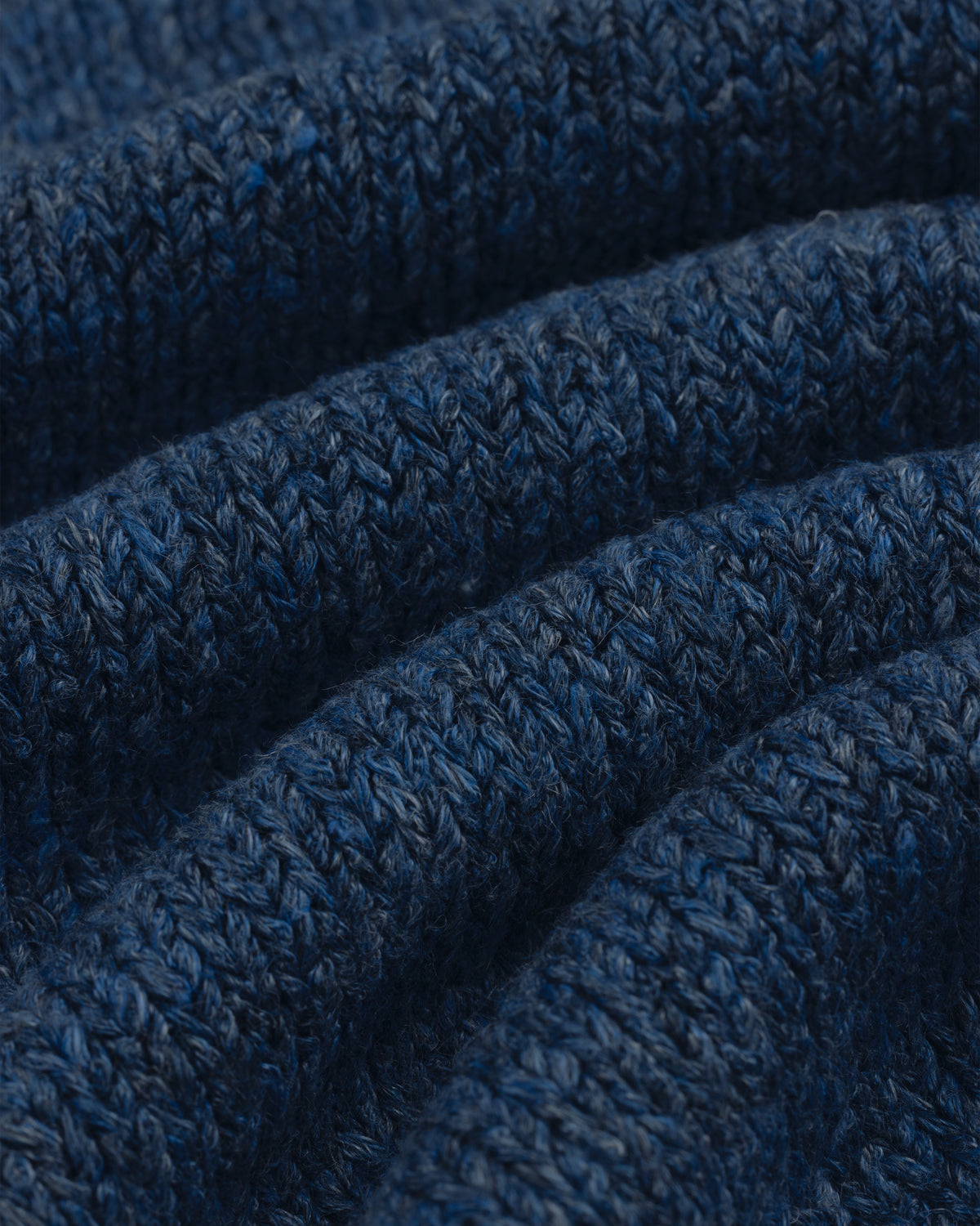 Close-up of textured blue Linen Knit Drawstring Short showing visible rows of stitches and soft folds.