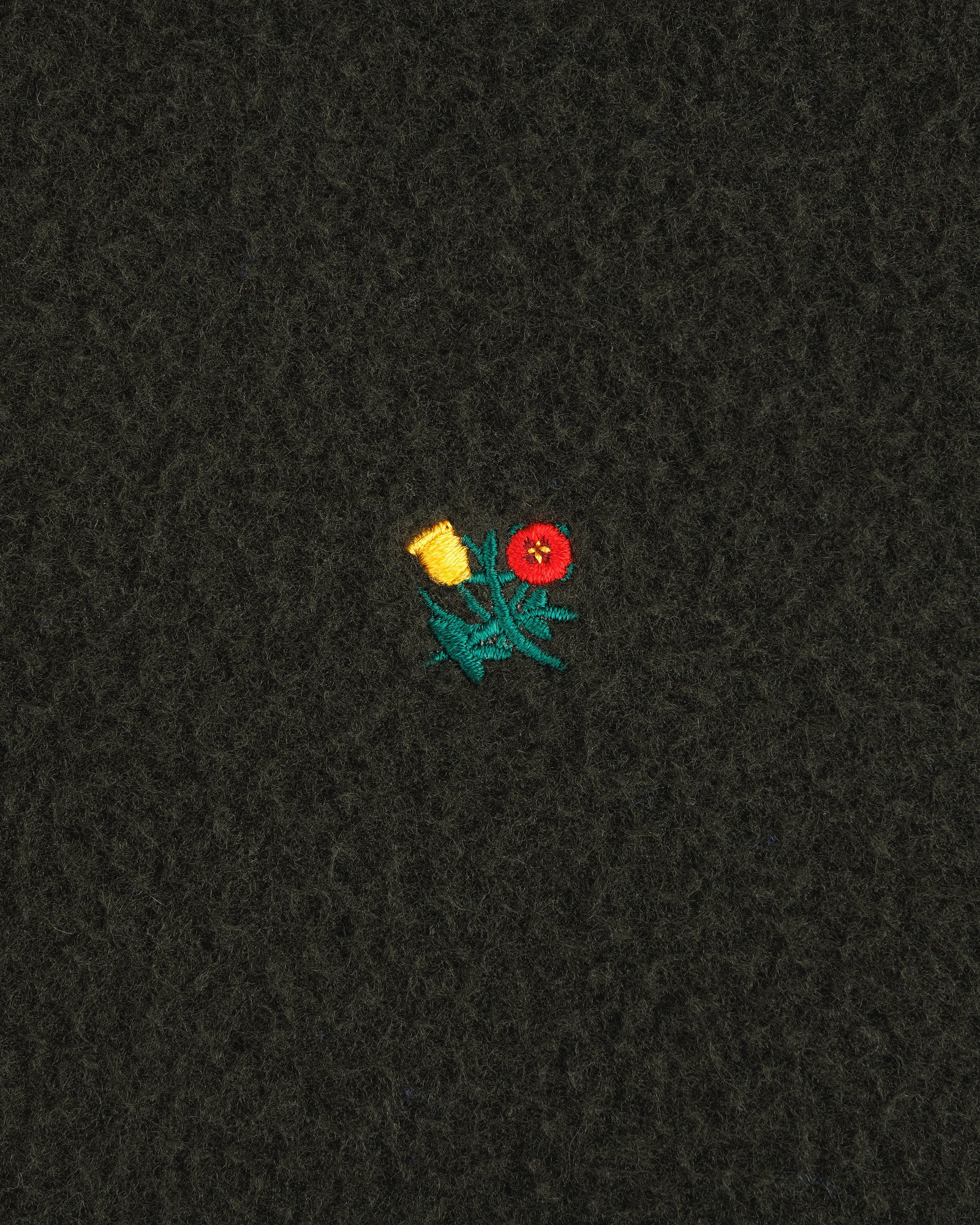 Small yellow and red embroidered flowers with green stems adorn the Casentino Crest Half-Zip Pullover.