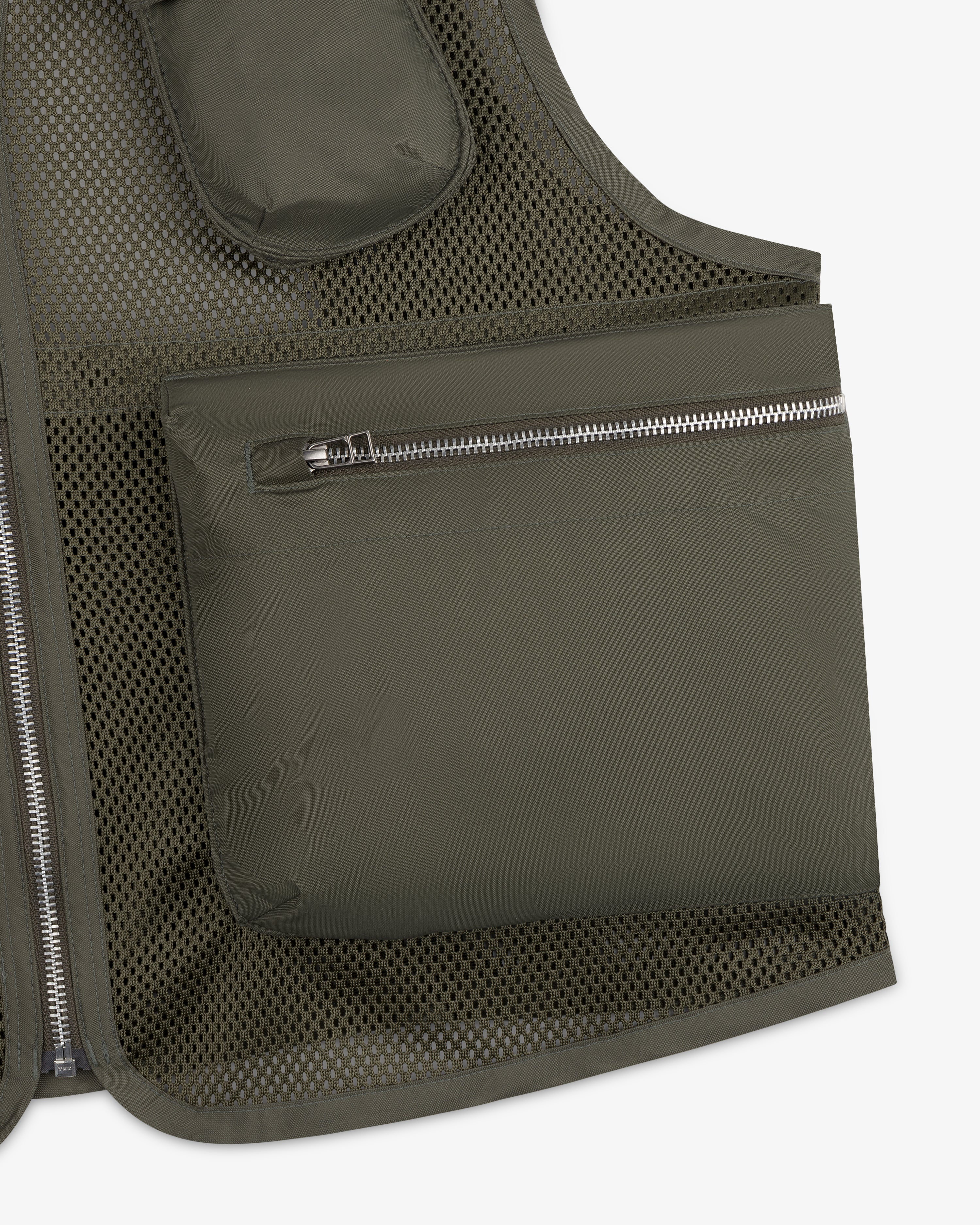 Close-up of a Nylon Utility Vest in olive green with mesh and a large side zippered pocket.