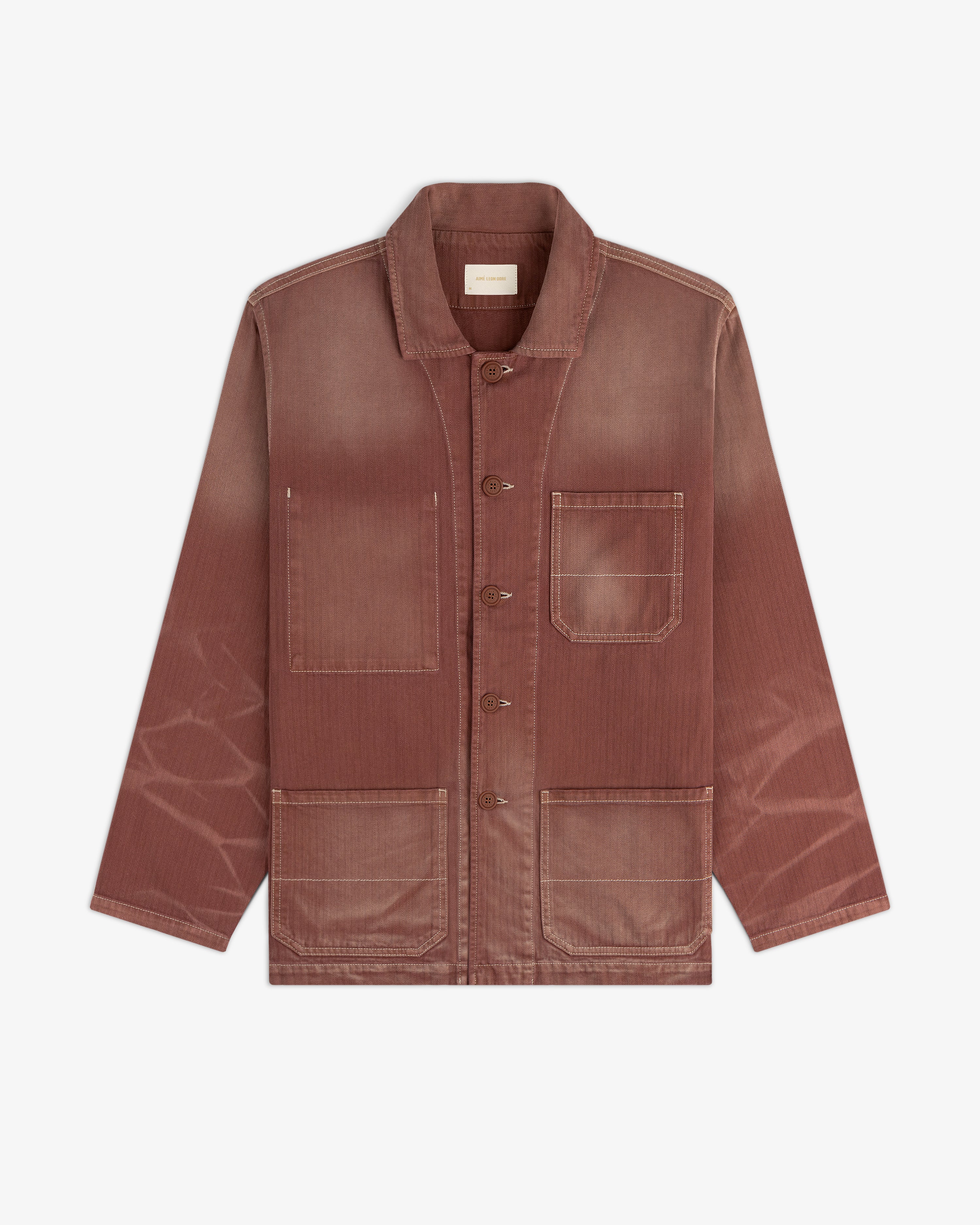 Sun Faded Chore Jacket: Rust-colored canvas with button closure, 3 front pockets, and subtle faded sleeve patterns.