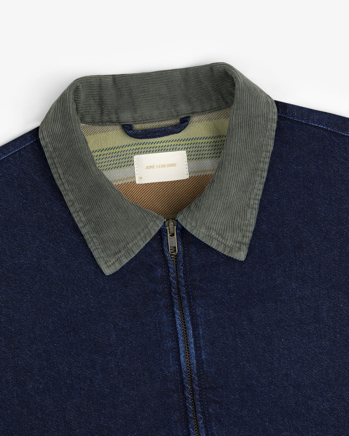 Denim Zip Jacket with green corduroy collar, zip closure, and striped lining visible near the label.