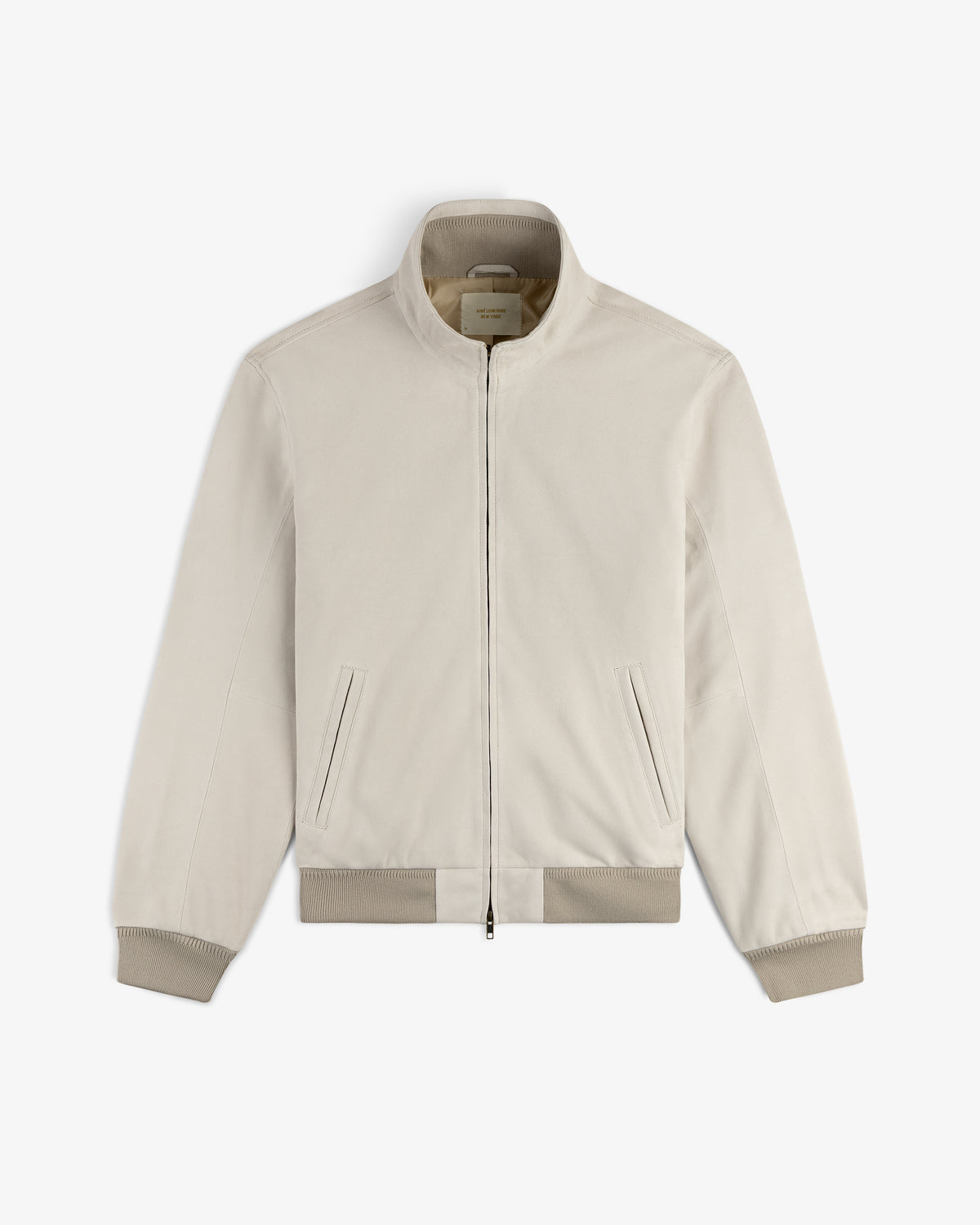 Suede Track Jacket in light beige with zip-up front, stand collar, ribbed cuffs, and side pockets, displayed flat.