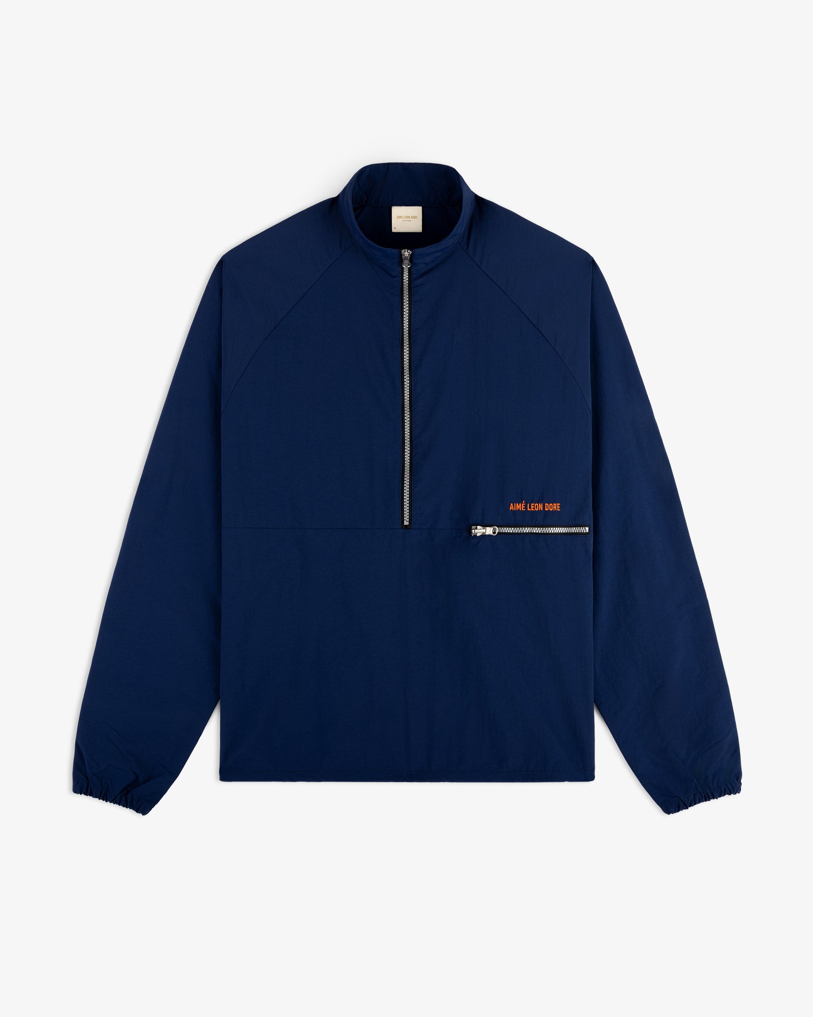 Nylon Packable Windbreaker in navy blue with half-zip front, diagonal pocket, and subtle orange text.