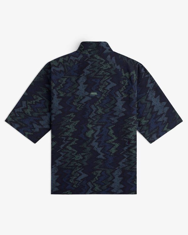 ALD Golf Nylon Quarter Zip Pullover with a dark blue and green zigzag pattern, shown from the back.
