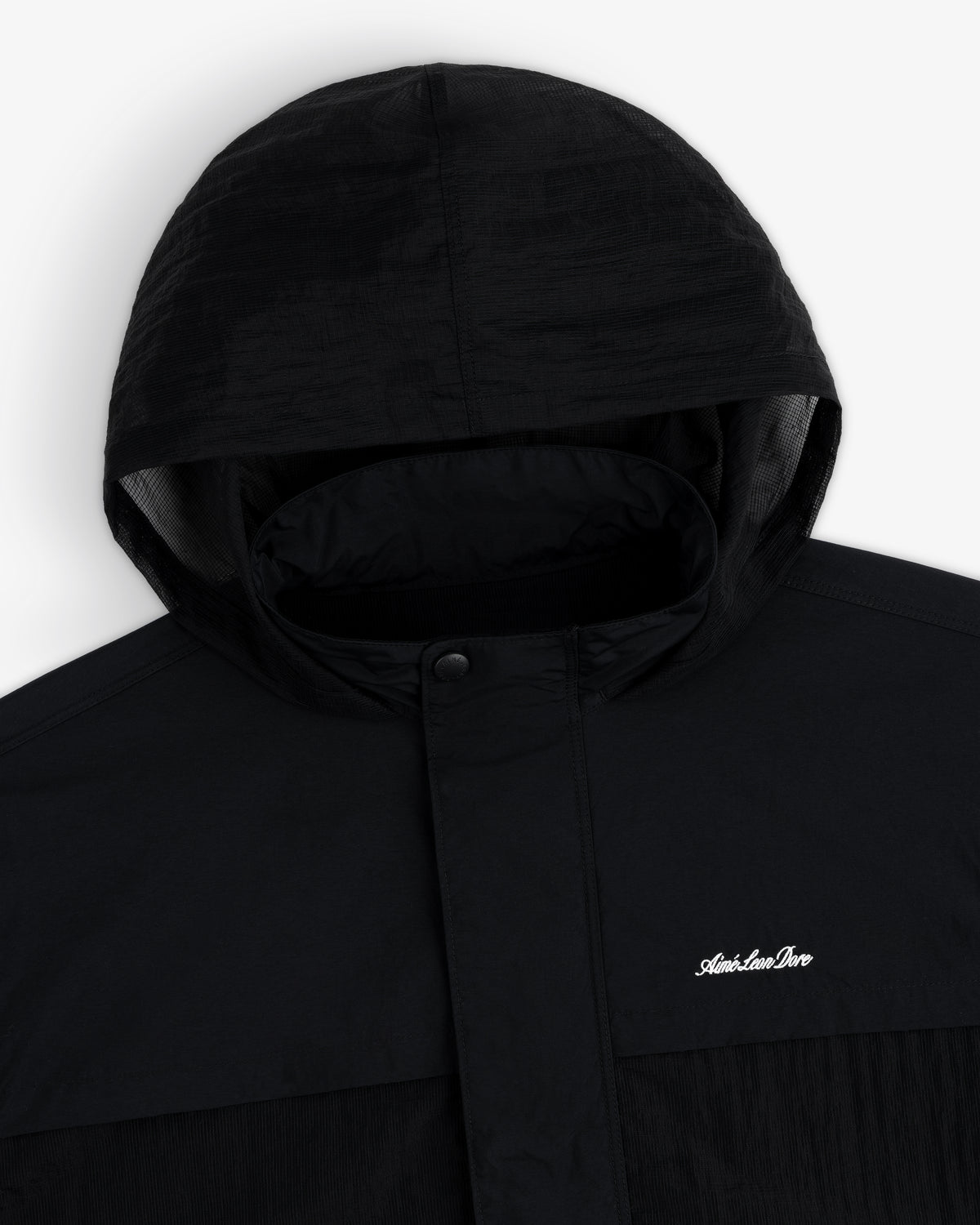 Black Nylon Track Jacket with snap button collar and small white "Adventure Pro" logo on the chest.