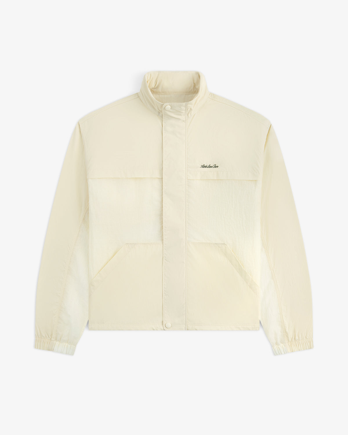 Light beige Nylon Track Jacket with long sleeves, snap buttons, front pockets, elastic cuffs, and left chest logo.