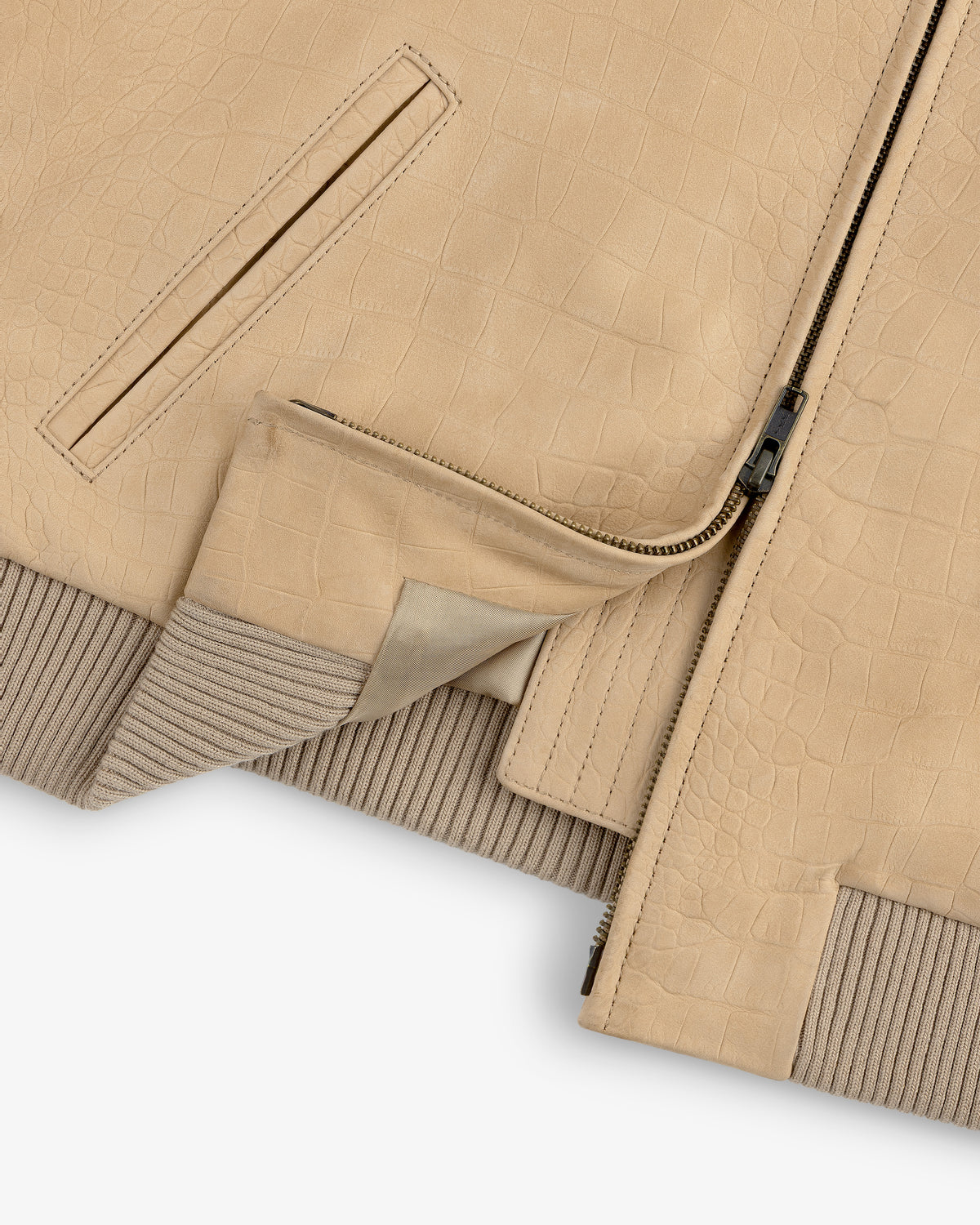 Close-up of the Croc-Embossed Nubuck Bomber Jacket with zipper, ribbed knit hem, and pocket details.