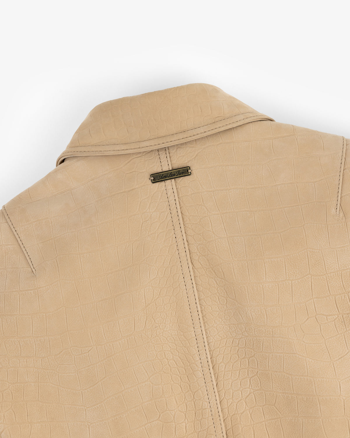 Croc-Embossed Nubuck Bomber Jacket featuring a collar and a metallic brand tag on the back near the neckline.