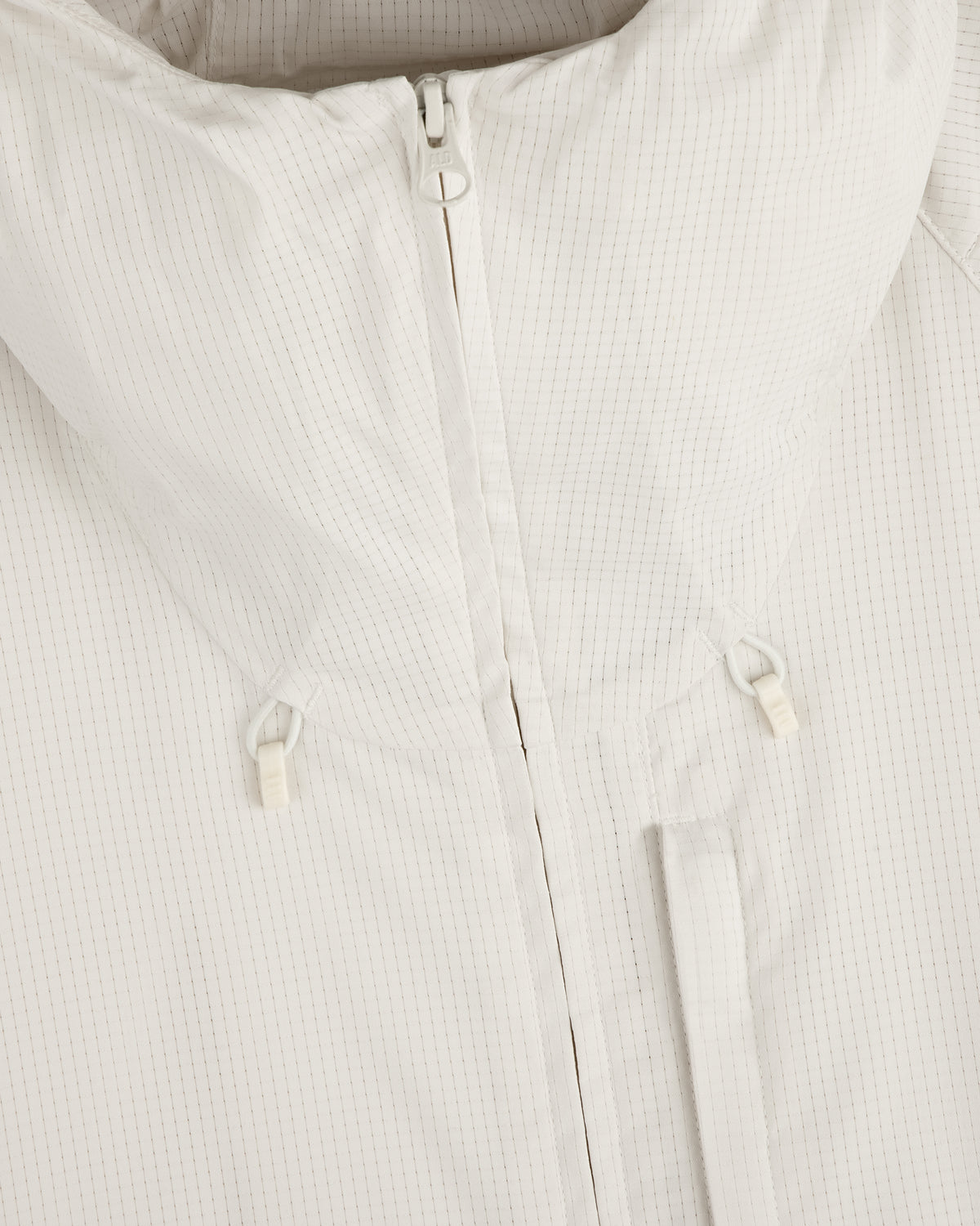 Close-up of the ALD Golf Lightweight Tips Windbreaker in white with high collar, front zipper, and drawstring toggles.