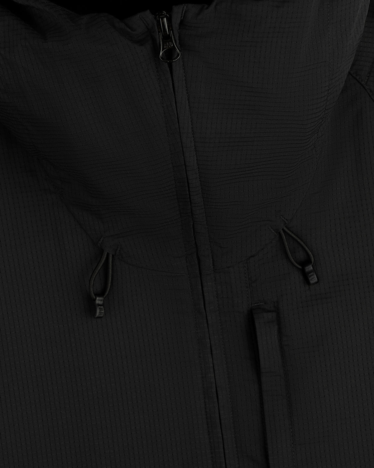 Close-up of the ALD Golf Lightweight Tips Windbreaker in black with hood, zipper, and drawstrings visible.