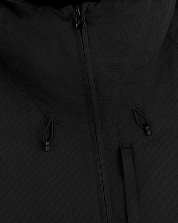 Close-up of the ALD Golf Lightweight Tips Windbreaker in black with hood, zipper, and drawstrings visible.