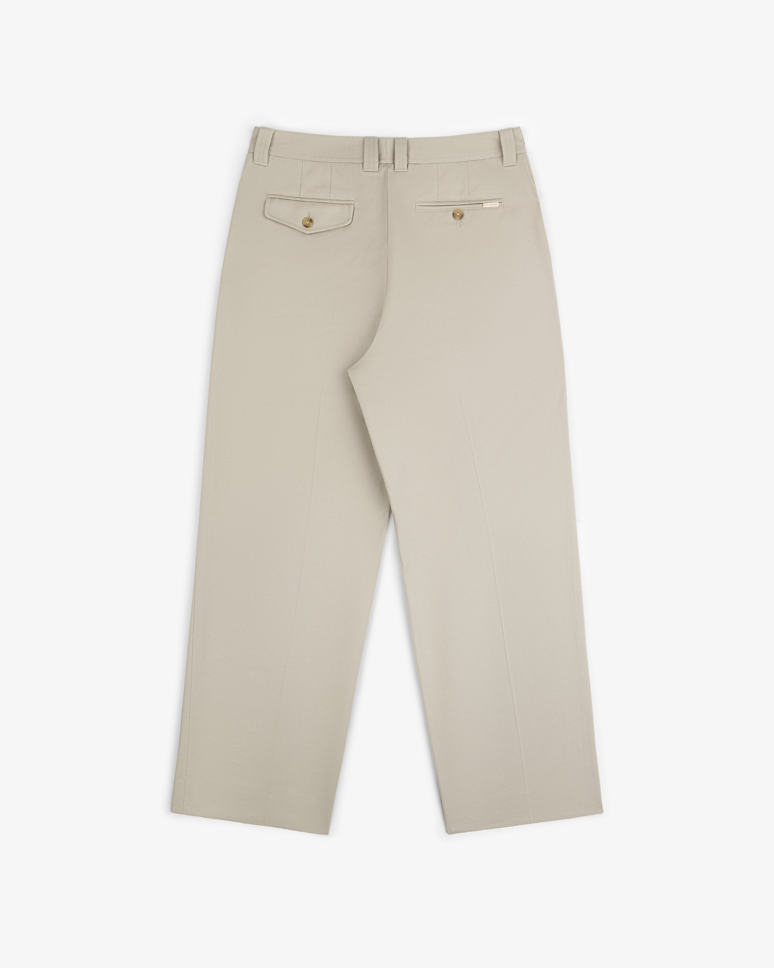 Officer Pant in beige shown from the back with two buttoned rear pockets and belt loops.