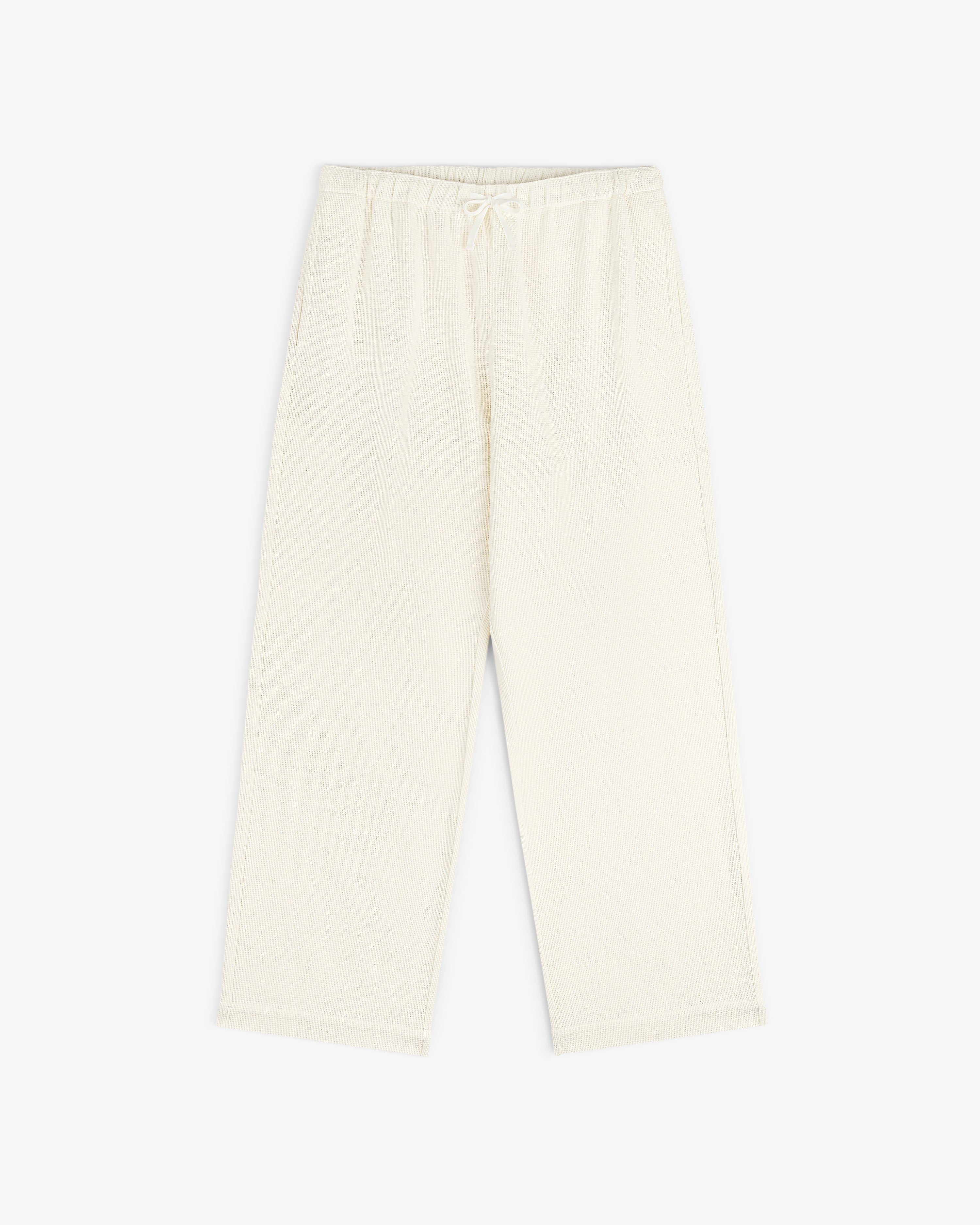 Cream Wide Leg Shore Pant with elastic waistband and side pockets, shown laid flat on a white background.