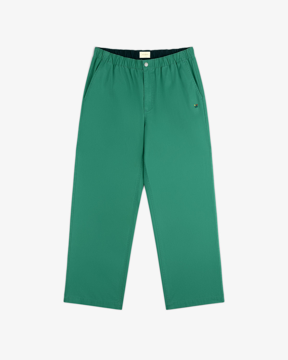 Washed Cotton Windbreaker Pant in green with elastic waistband, side pockets, and relaxed fit on white background.