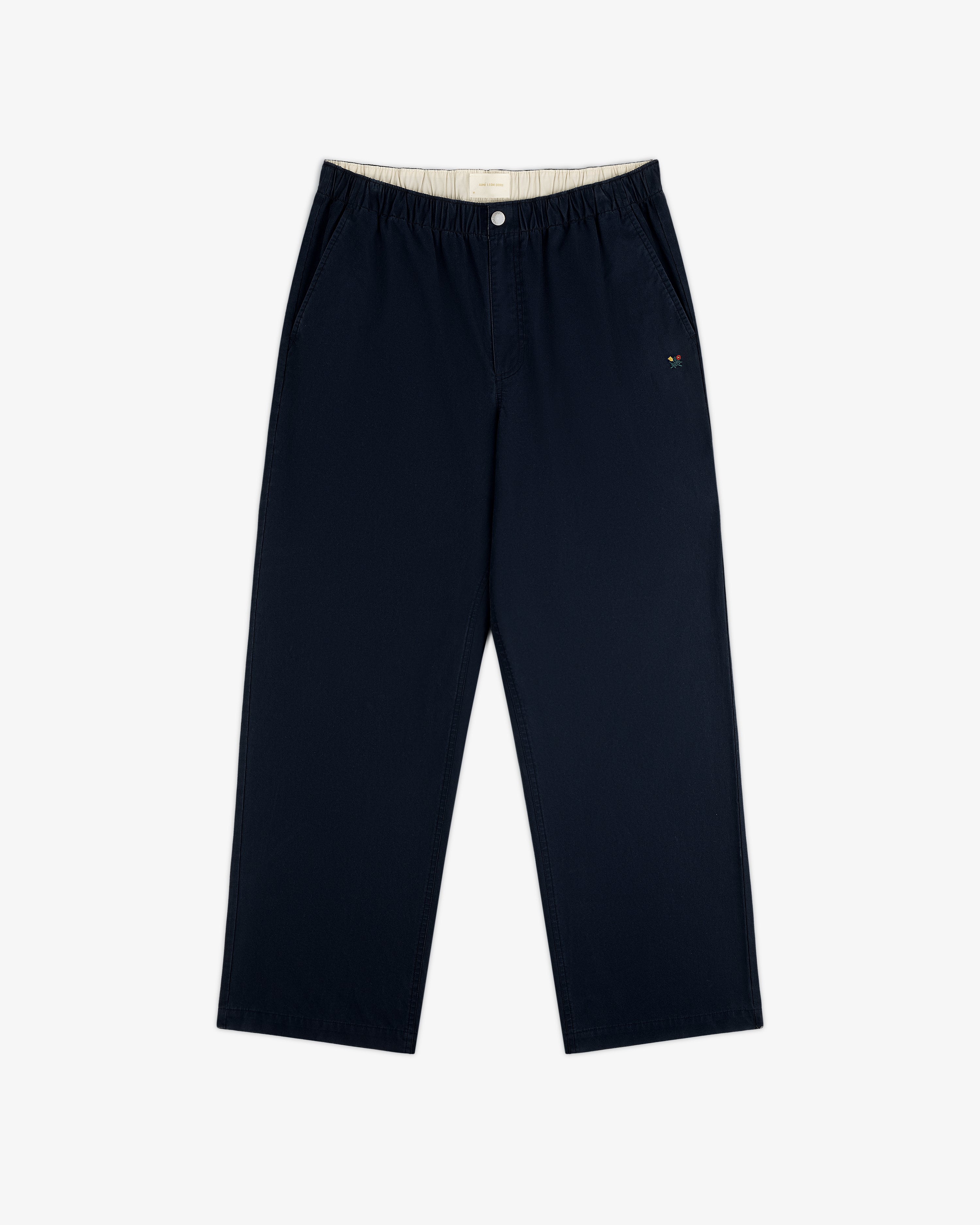 Washed Cotton Windbreaker Pant in navy blue features wide legs, elastic waistband, and small logo on left pocket.