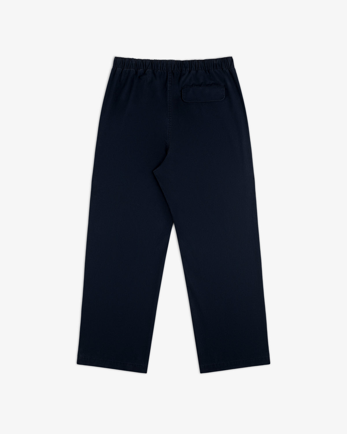 Washed Cotton Windbreaker Pant in navy blue with elastic waistband and single back pocket, shown on white background.