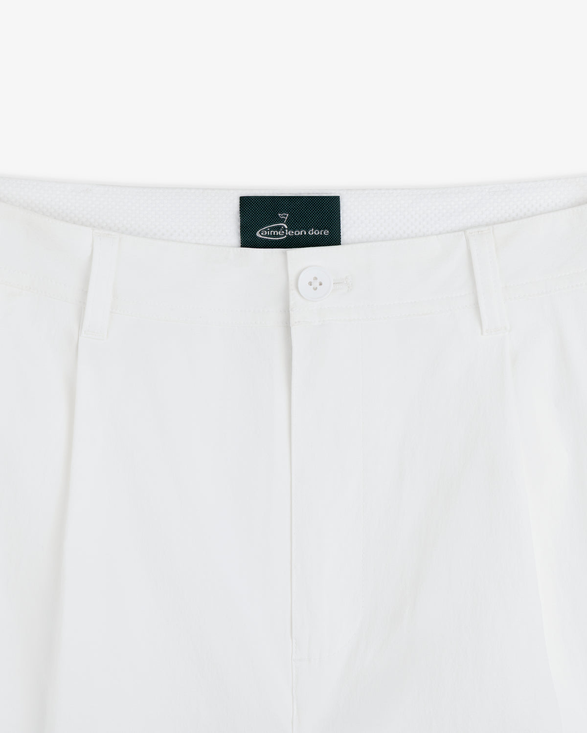 Close-up of the waistband and button of white ALD Golf Cordura Double Pleated Pant with belt loops and brand label.