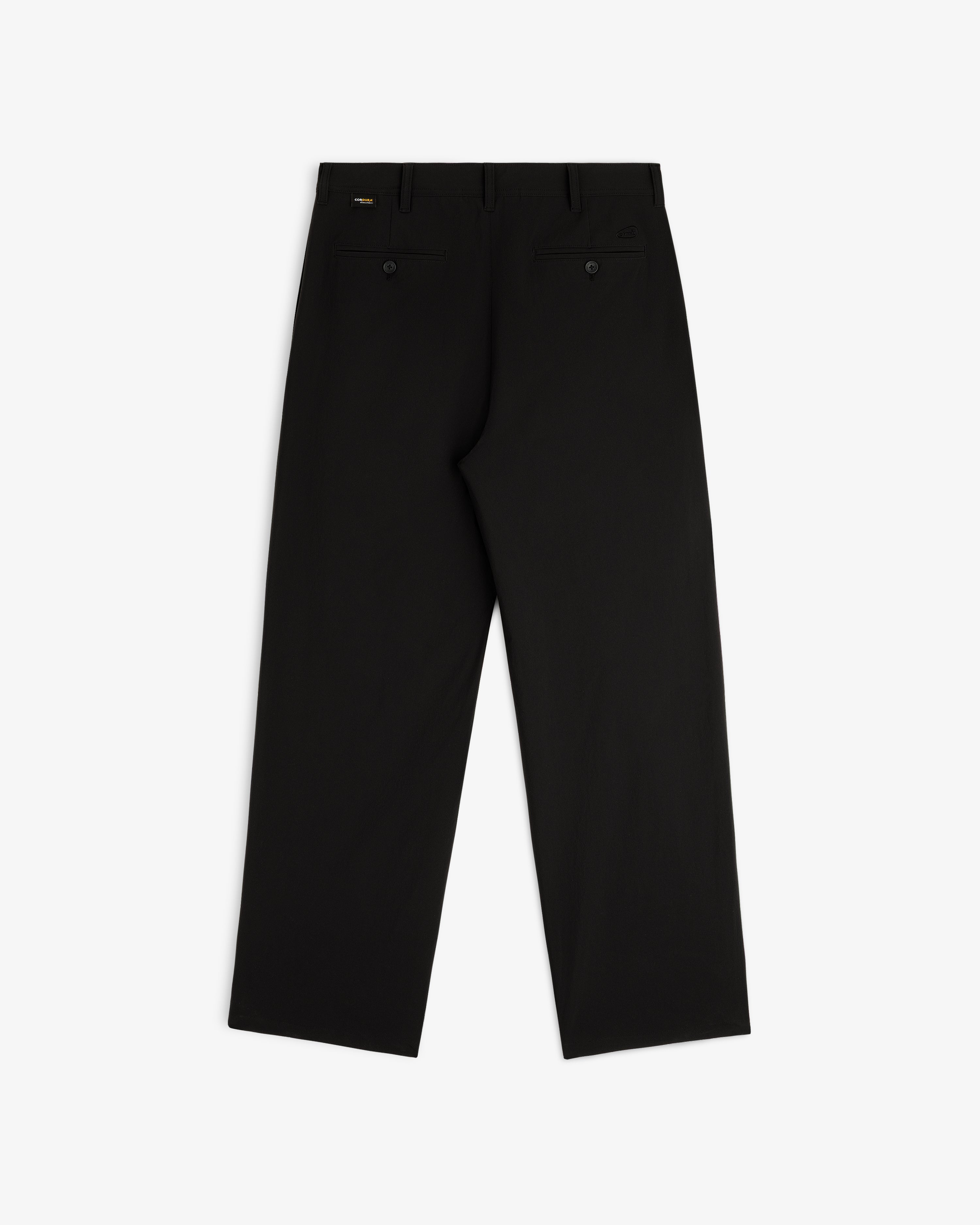 ALD Golf Cordura Double Pleated Pant laid flat, back view, with belt loops and two buttoned back pockets.