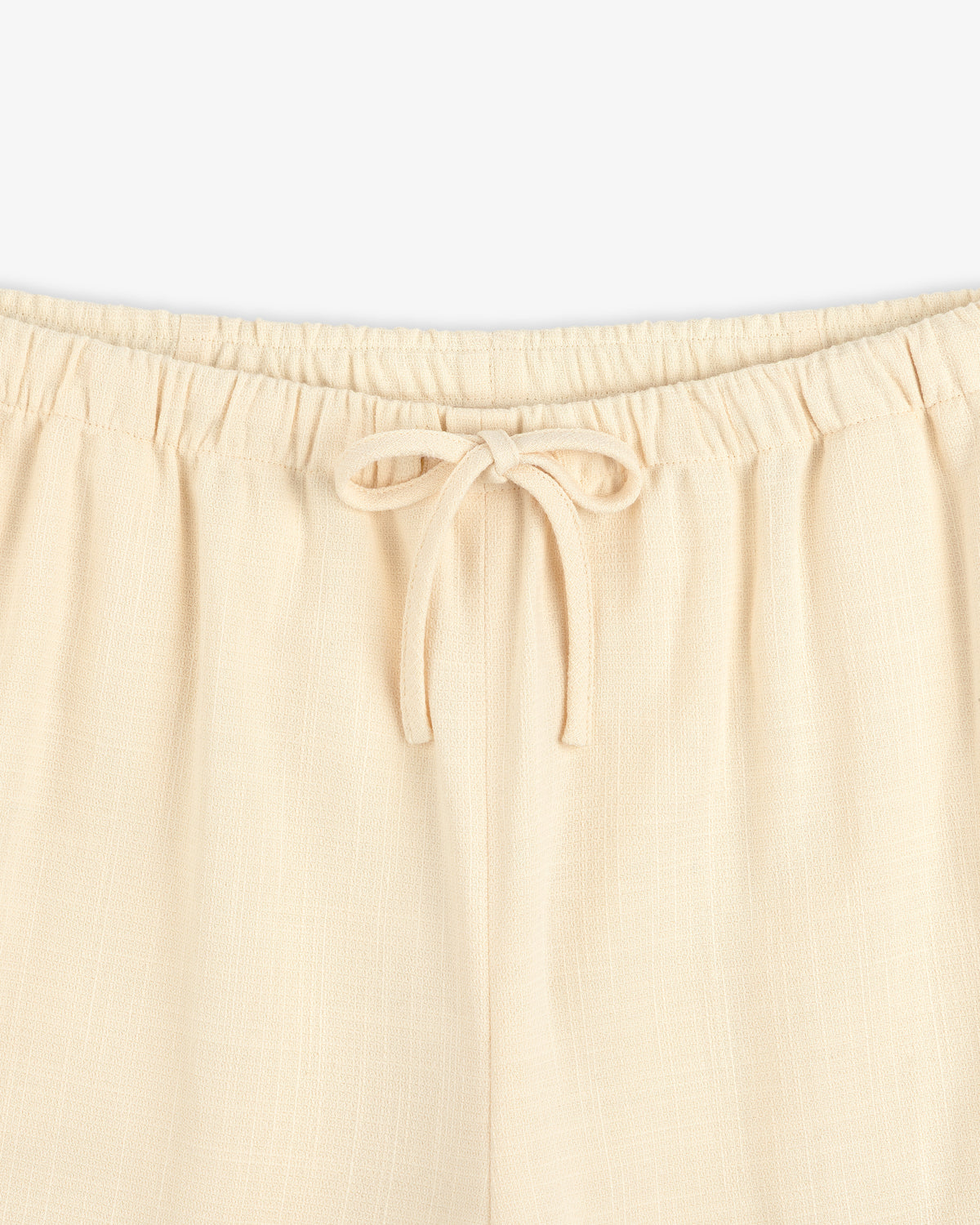 Drawstring Cotton Blend Suit Trouser in beige, featuring an elastic waistband; waist to upper thigh shown on white background.