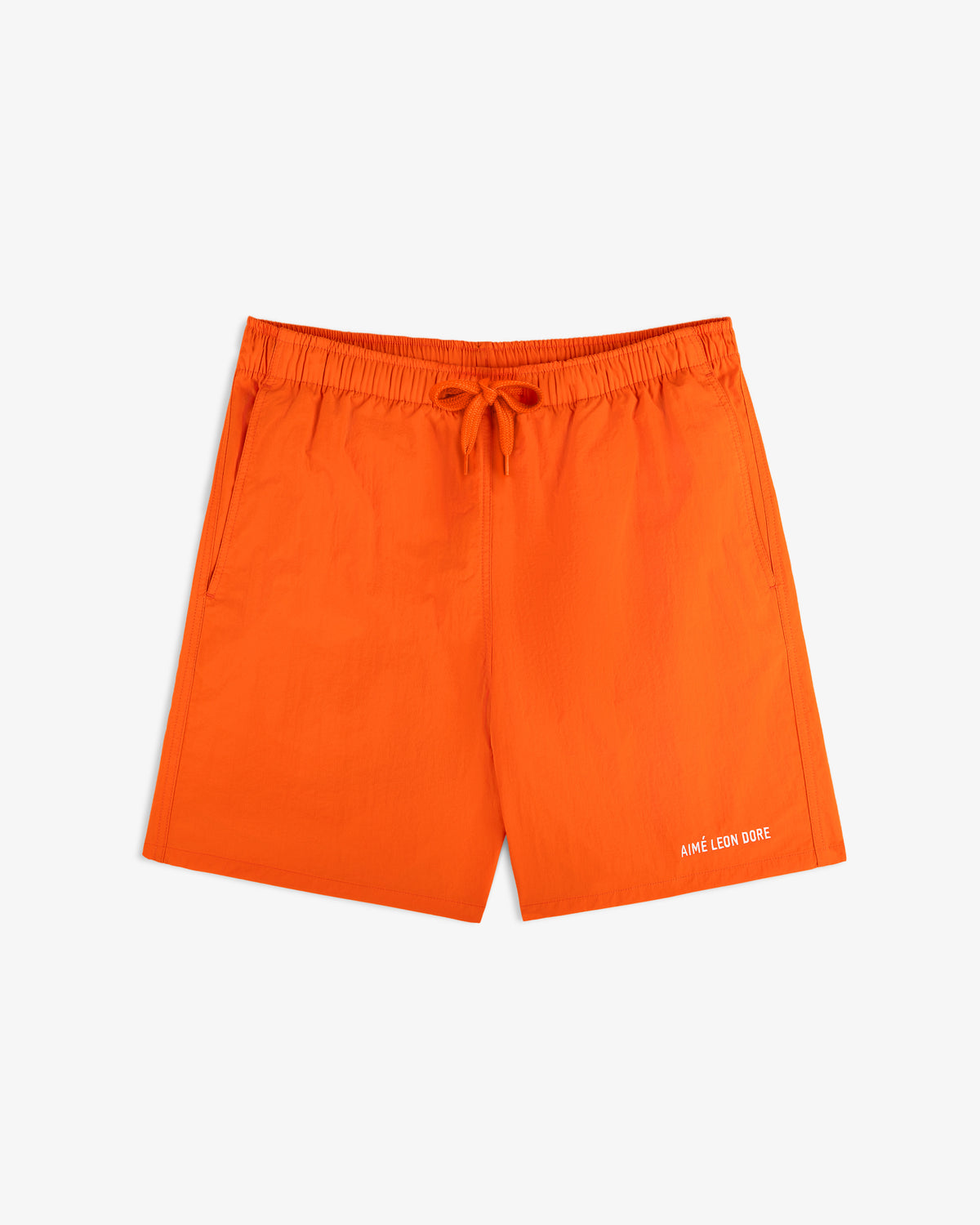 Bright orange Logo Swim Short with drawstring waist, side pockets, and Aime Leon Dore text on the front left hem.