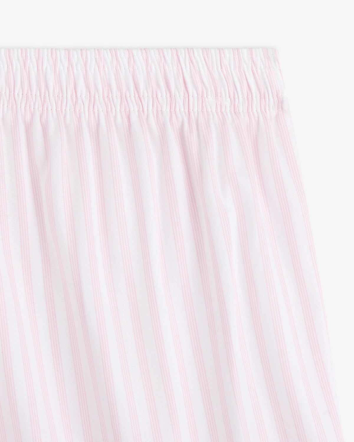 Close-up of Striped Boxer Short featuring white fabric with light pink vertical stripes and an elastic waistband.
