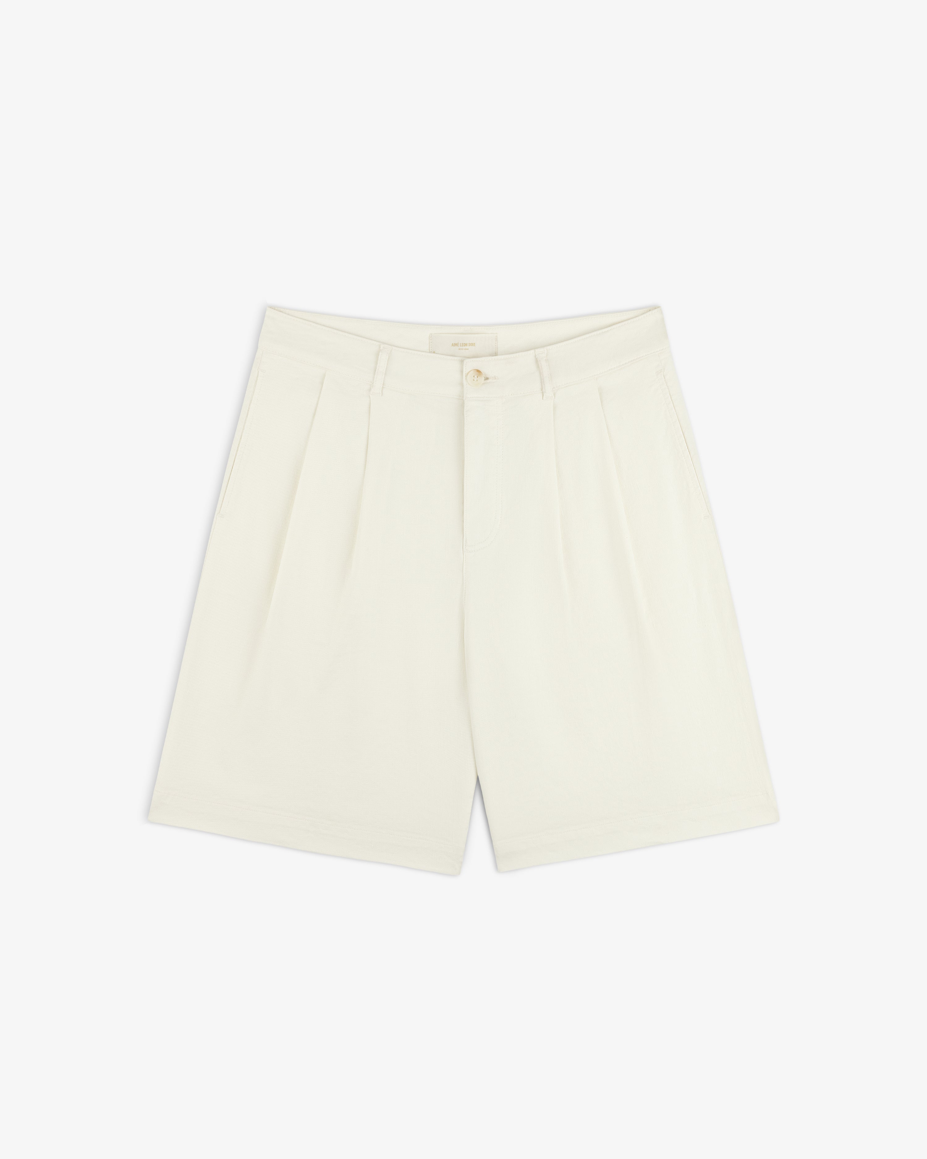 Pleated Linen Blend Bermuda Short in cream with side pockets, front button, and zipper closure on a white background.