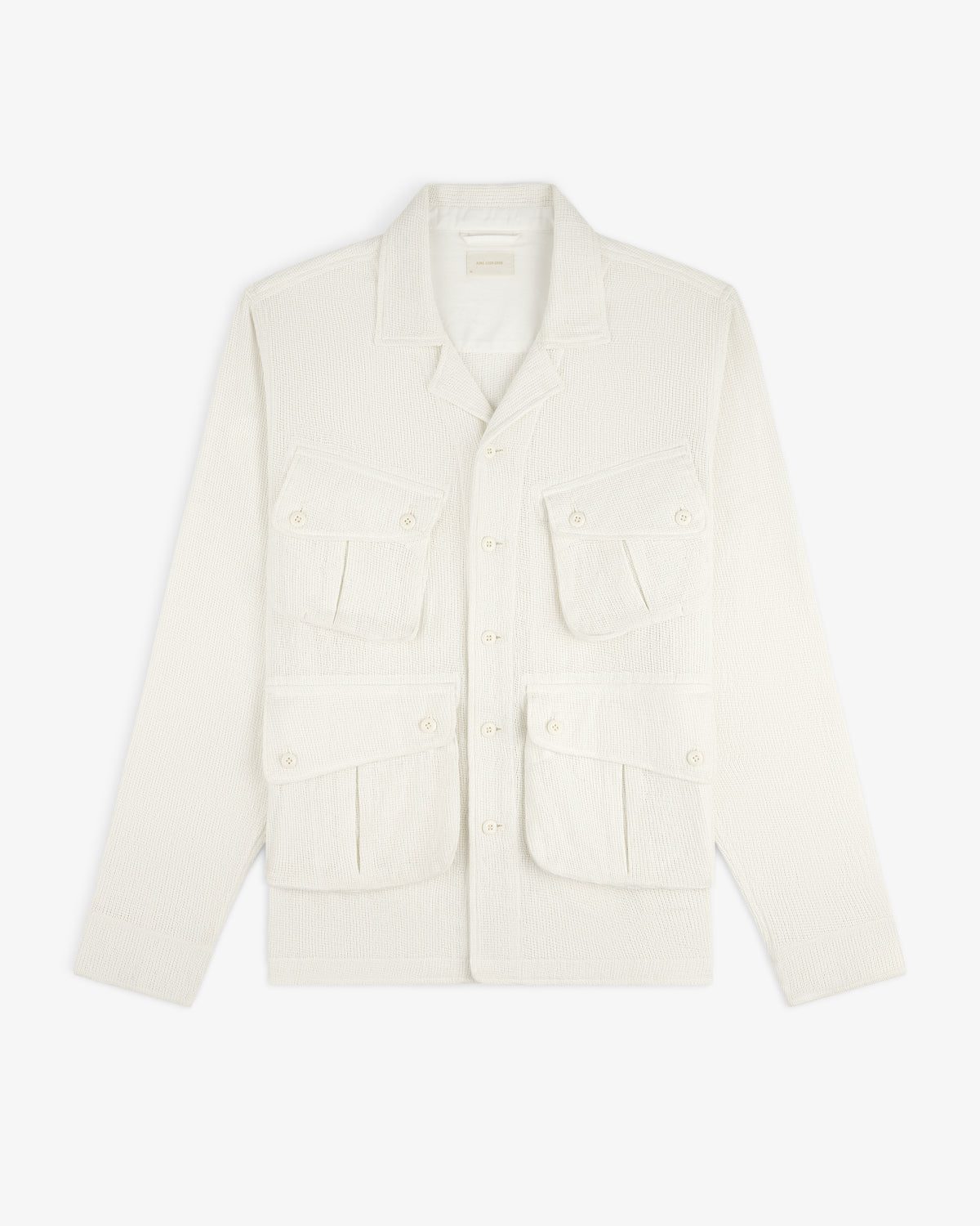 Cream-colored Mesh Jungle Shirt with four front pockets and button closures, laid flat on a white background.