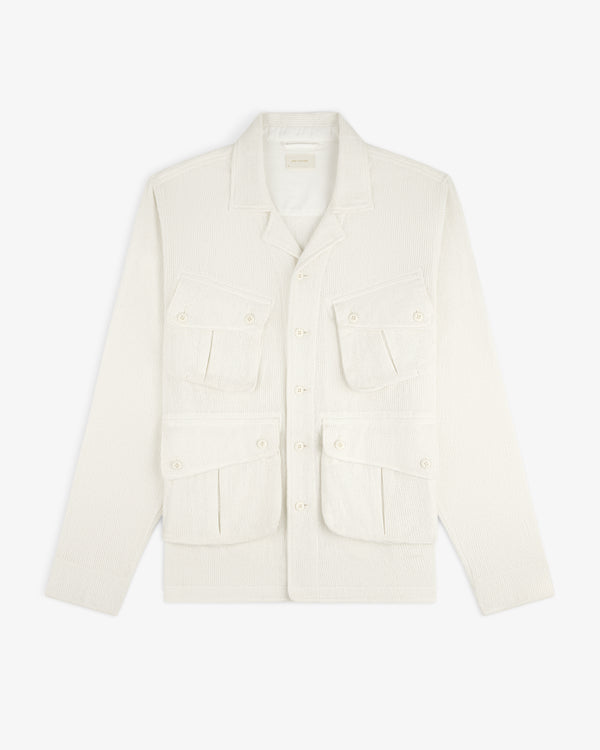 Cream-colored Mesh Jungle Shirt with four front pockets and button closures, laid flat on a white background.