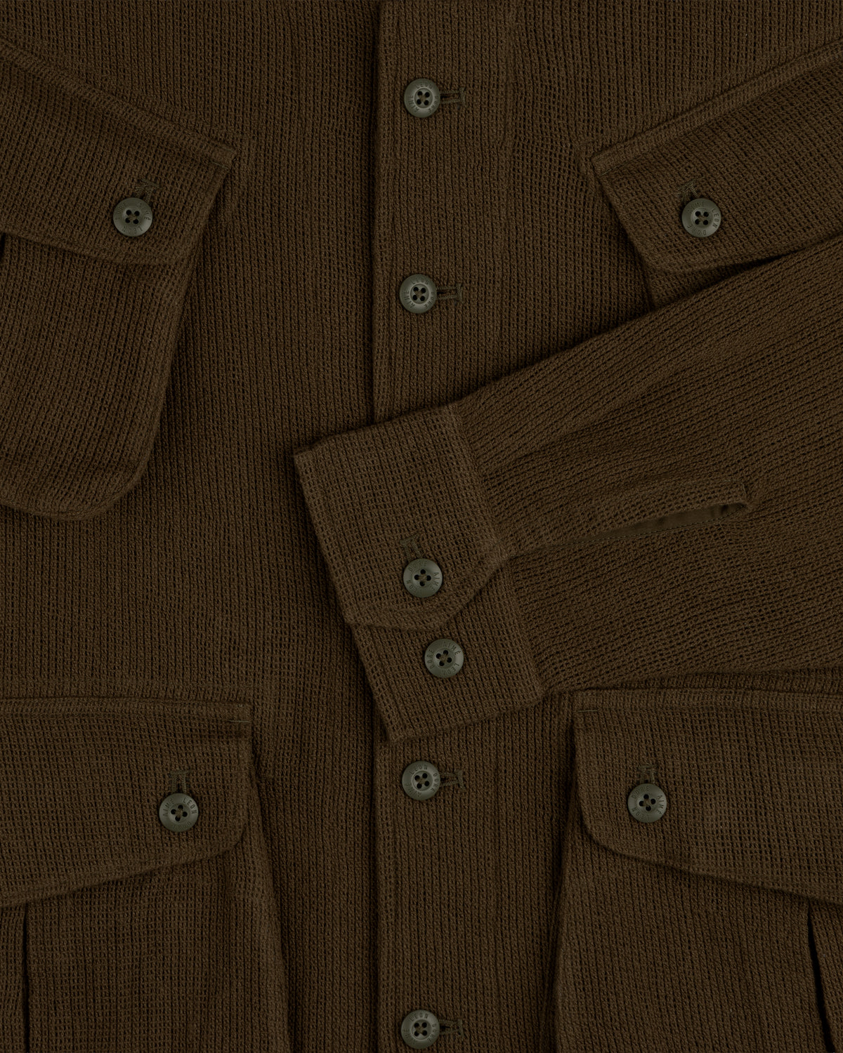Mesh Jungle Shirt with buttoned front, flap pockets, and long sleeves overlapping at the center.