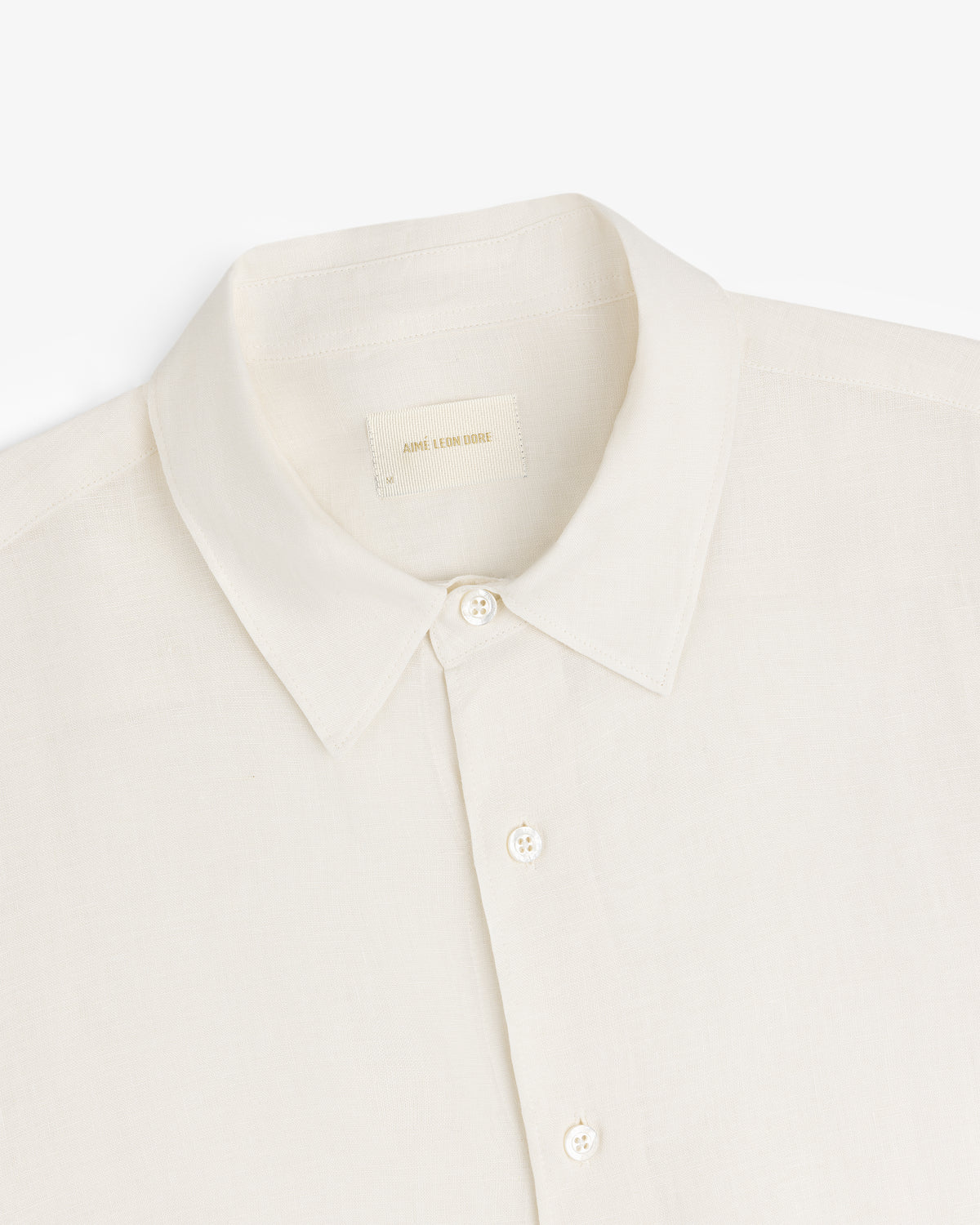 Long-Sleeve Linen Shirt in cream with collar and buttons, shown top front on a white background.