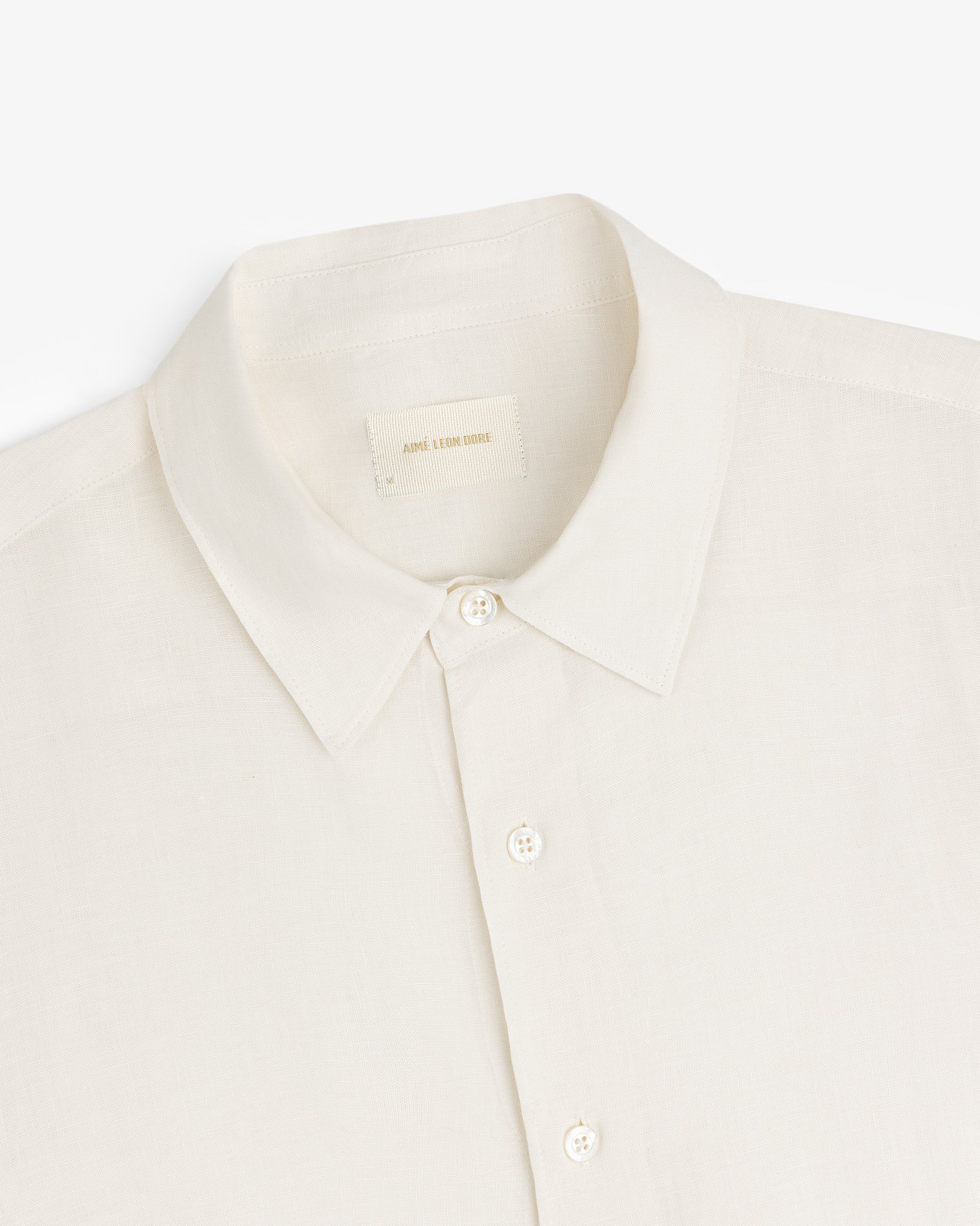 Long-Sleeve Linen Shirt in cream with collar and buttons, shown top front on a white background.
