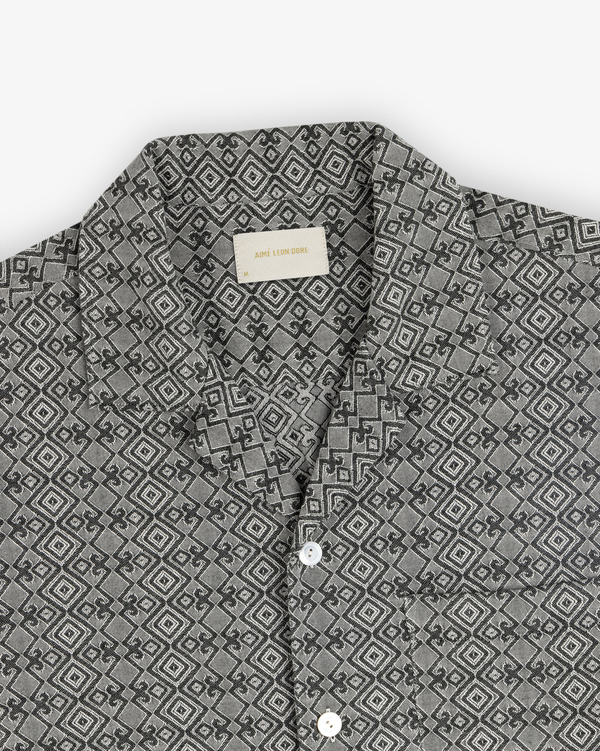 Jacquard Leisure Shirt in gray with a geometric diamond pattern and white buttons, laid flat on a white background.