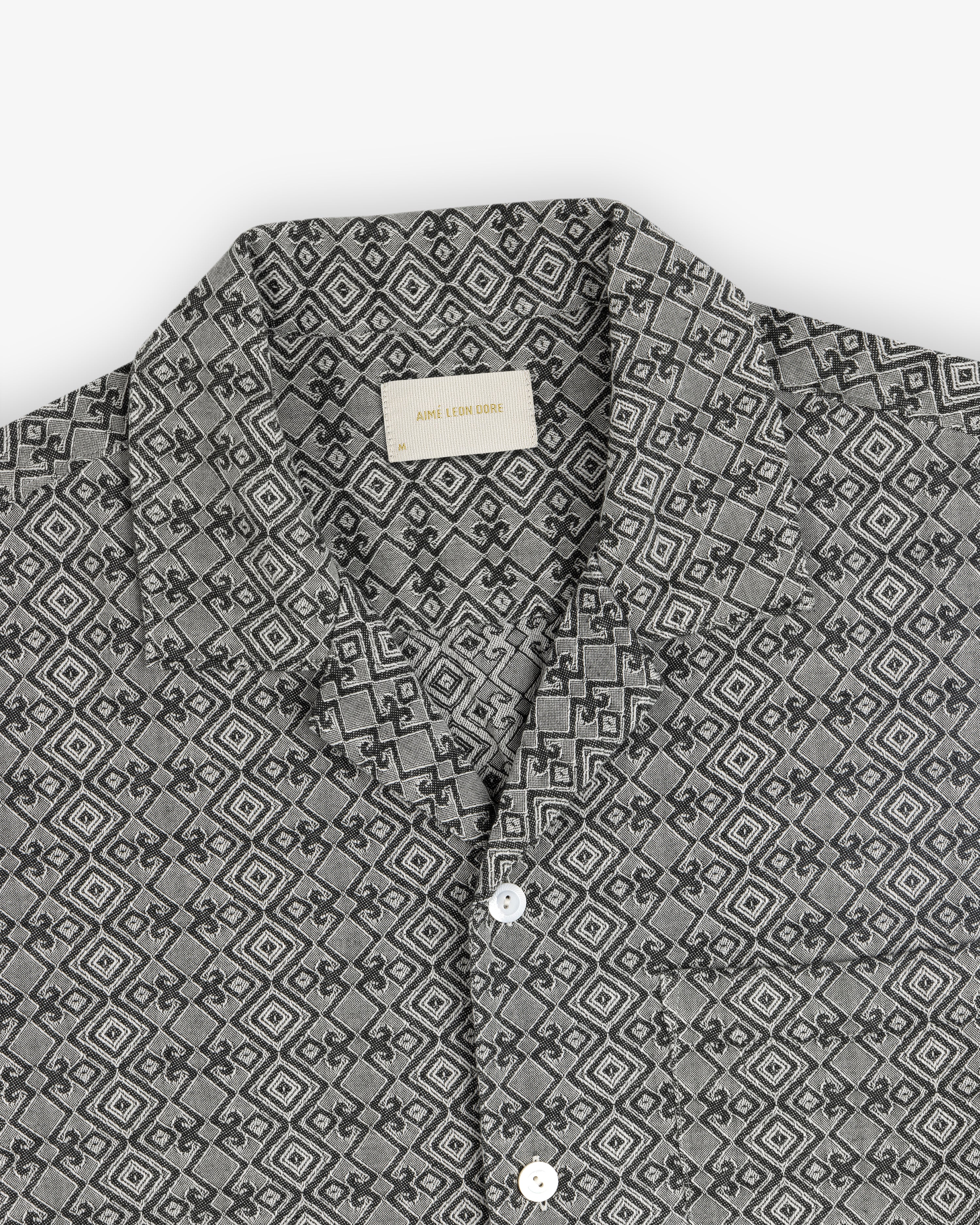 Jacquard Leisure Shirt in gray with a geometric diamond pattern and white buttons, laid flat on a white background.