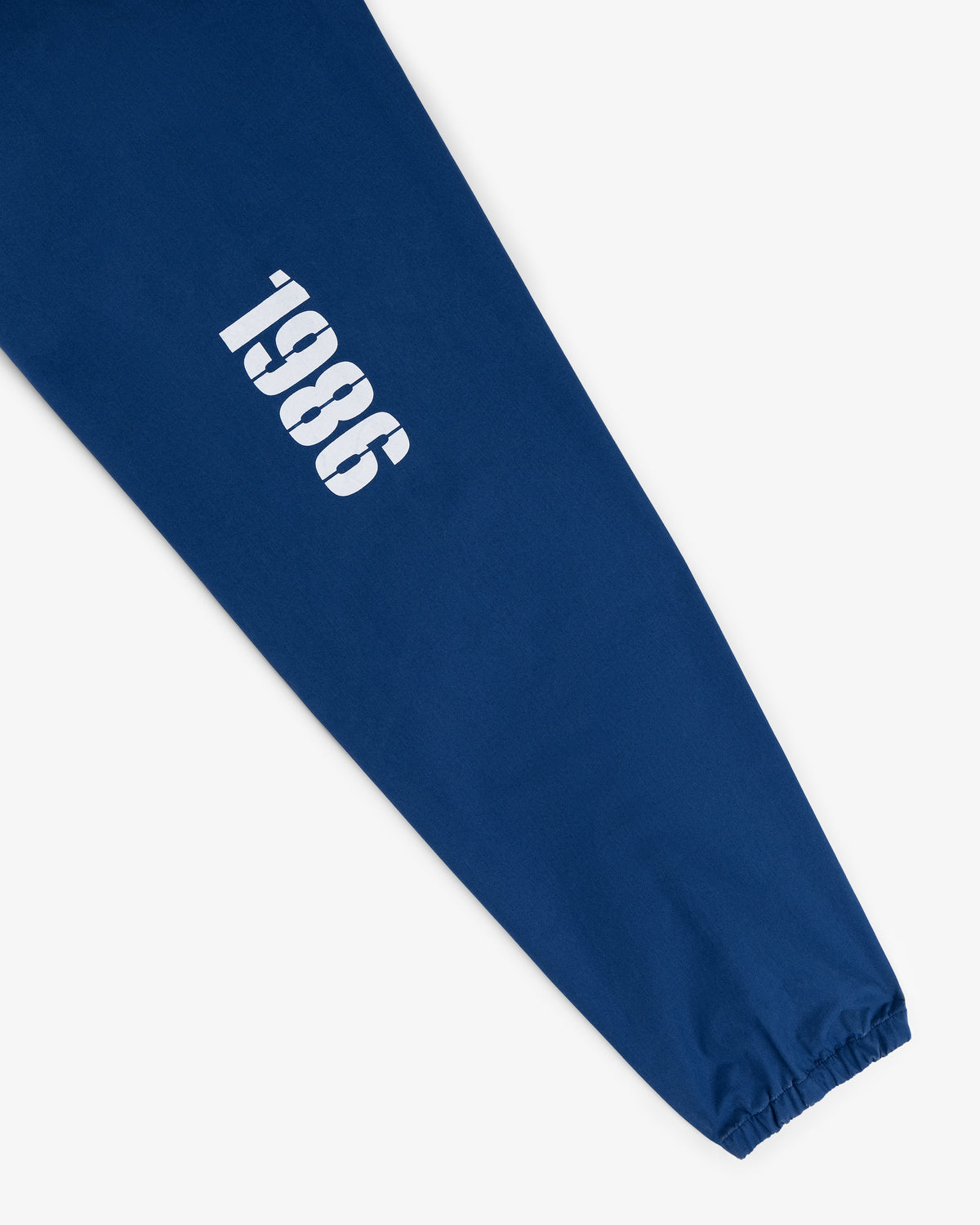 A Marina Jacket featuring a blue sleeve with "1986" printed in white near the wrist.