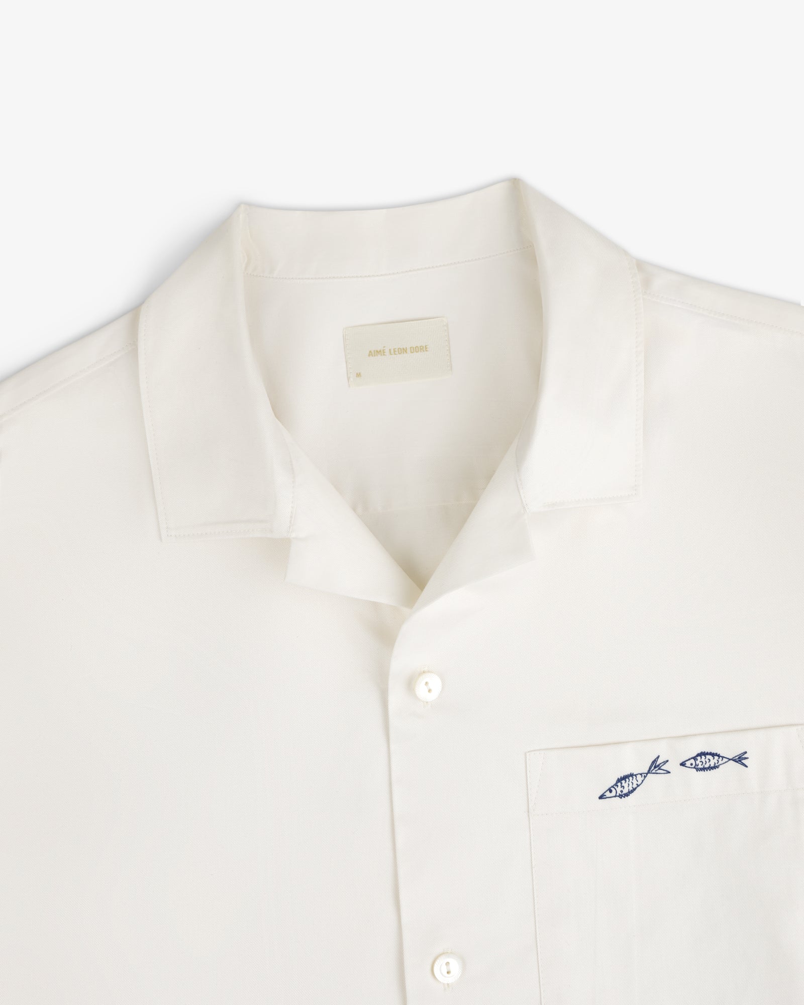 Fassianos "Rendez - Vous" Camp Shirt: White button-up with collar and chest pocket embroidered with two blue fish.