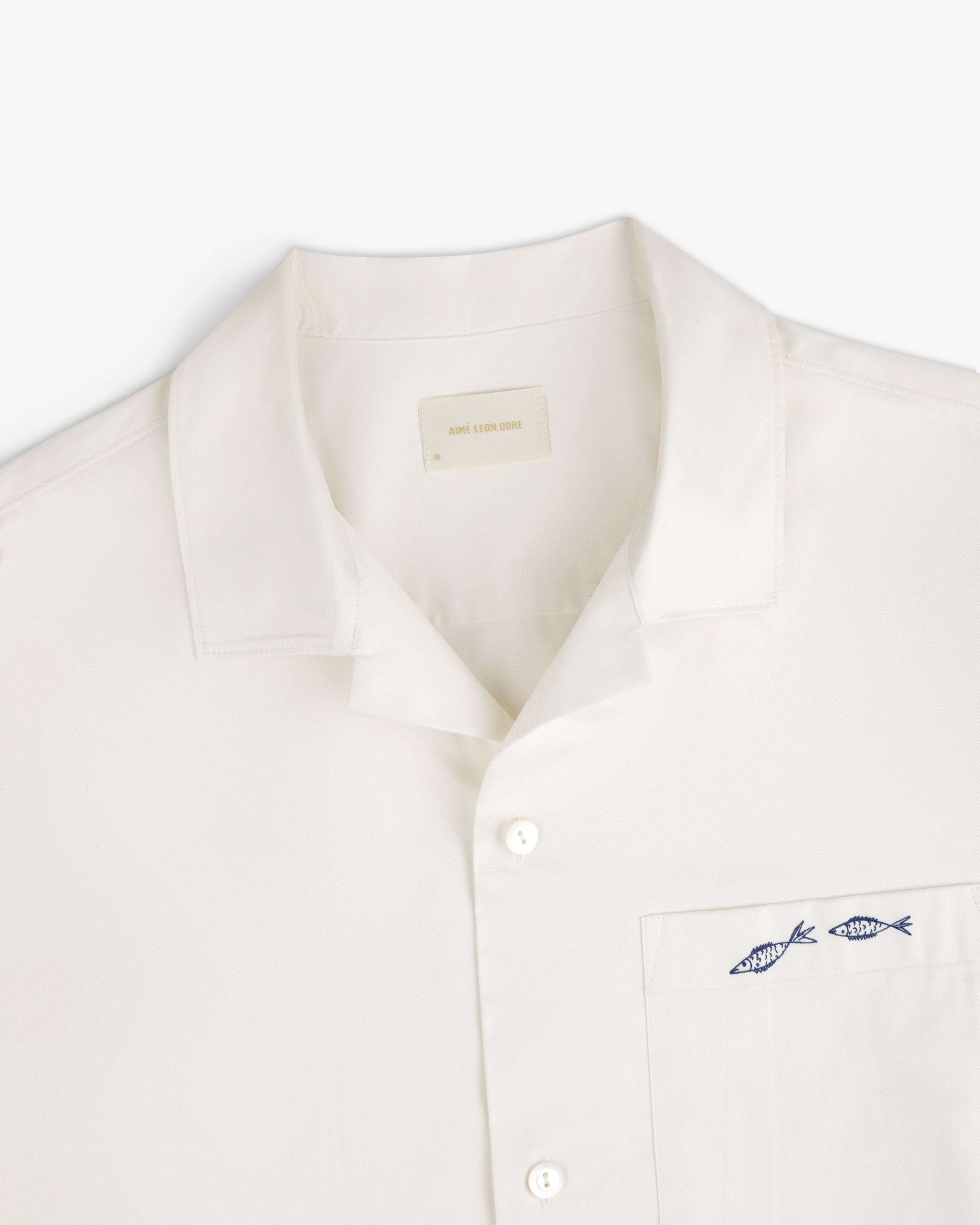 Fassianos "Rendez - Vous" Camp Shirt: White button-up with collar and chest pocket embroidered with two blue fish.
