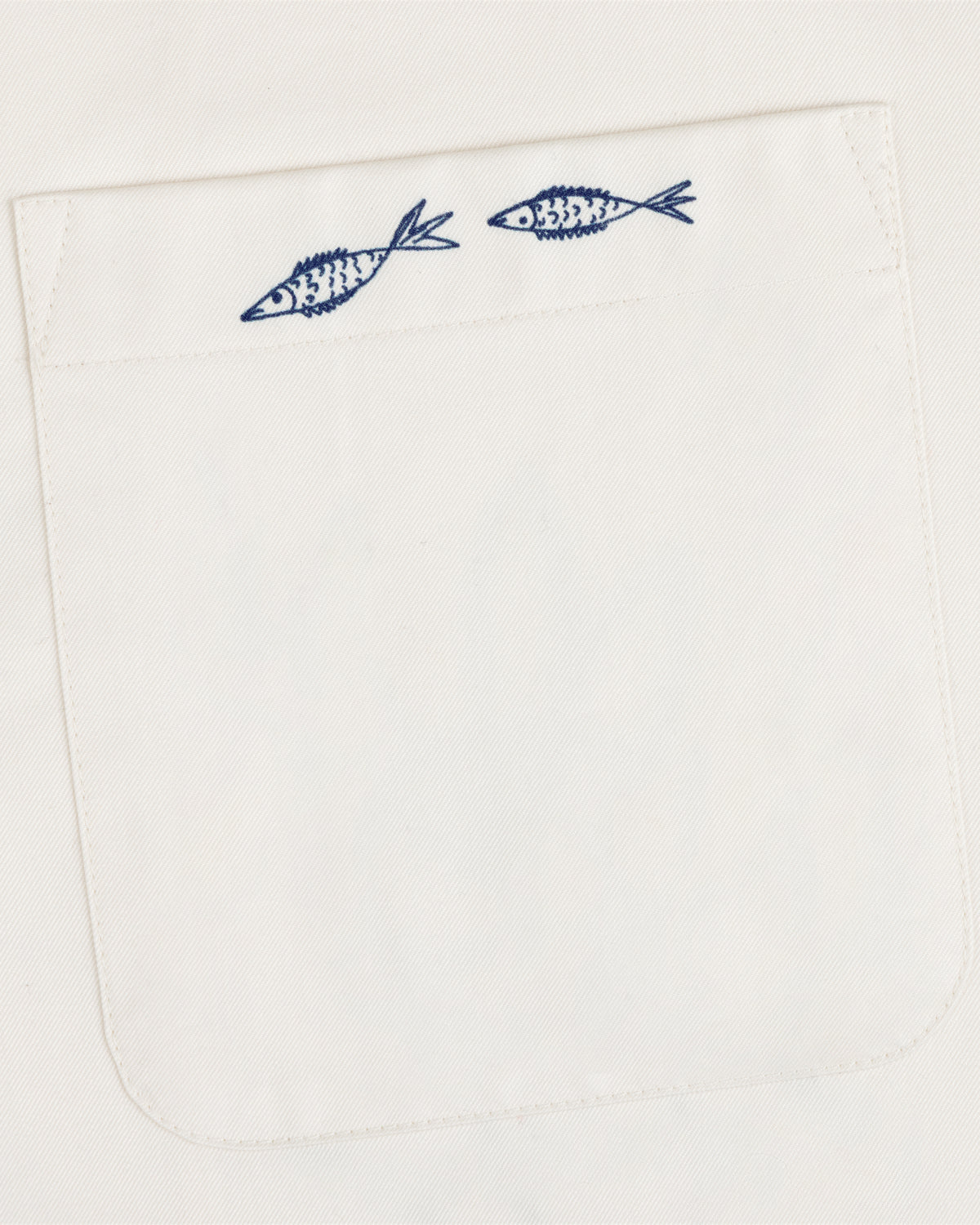 The Fassianos "Rendez-Vous" Camp Shirt features a white fabric pocket with two small blue fish above the opening.