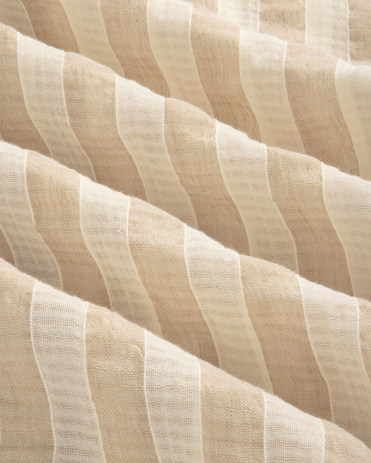 Close-up of the Linen Blend Striped Camp Shirt's beige and white, semi-sheer, wavy-textured fabric.