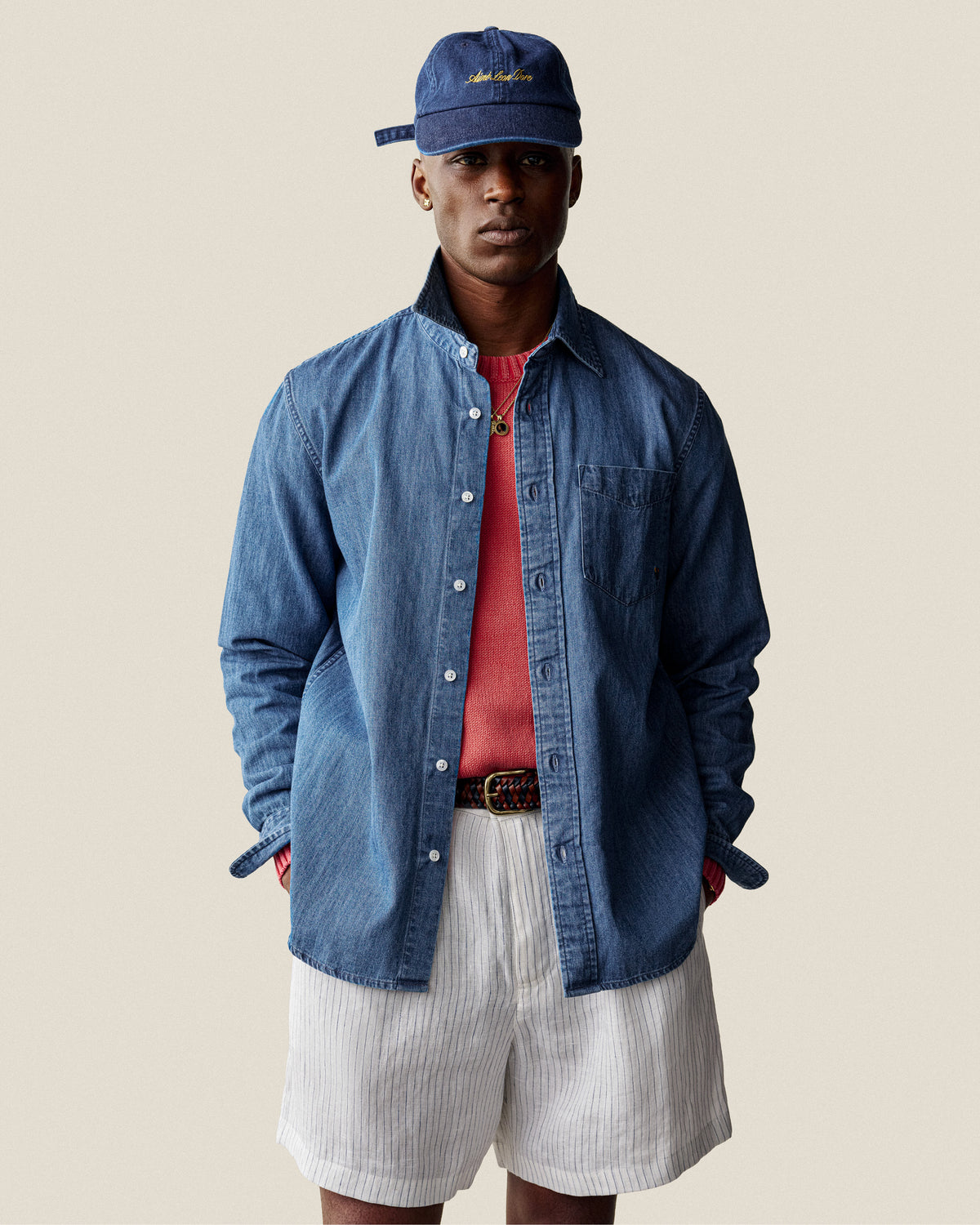 A man wearing the Washed Inside Out Sweater stands against a plain background.